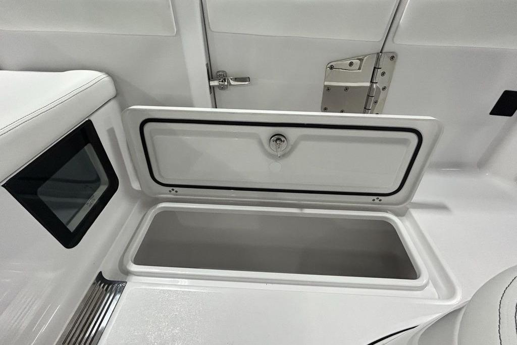 2026 Sportsman Heritage 321 Center Console storage compartment with open hatch and sleek design.