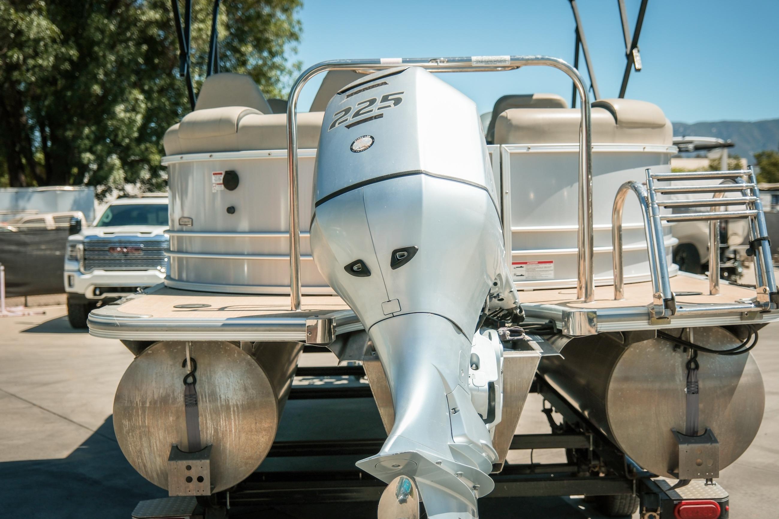 2019 Berkshire 25CLE STS pontoon boat with powerful outboard motor.
