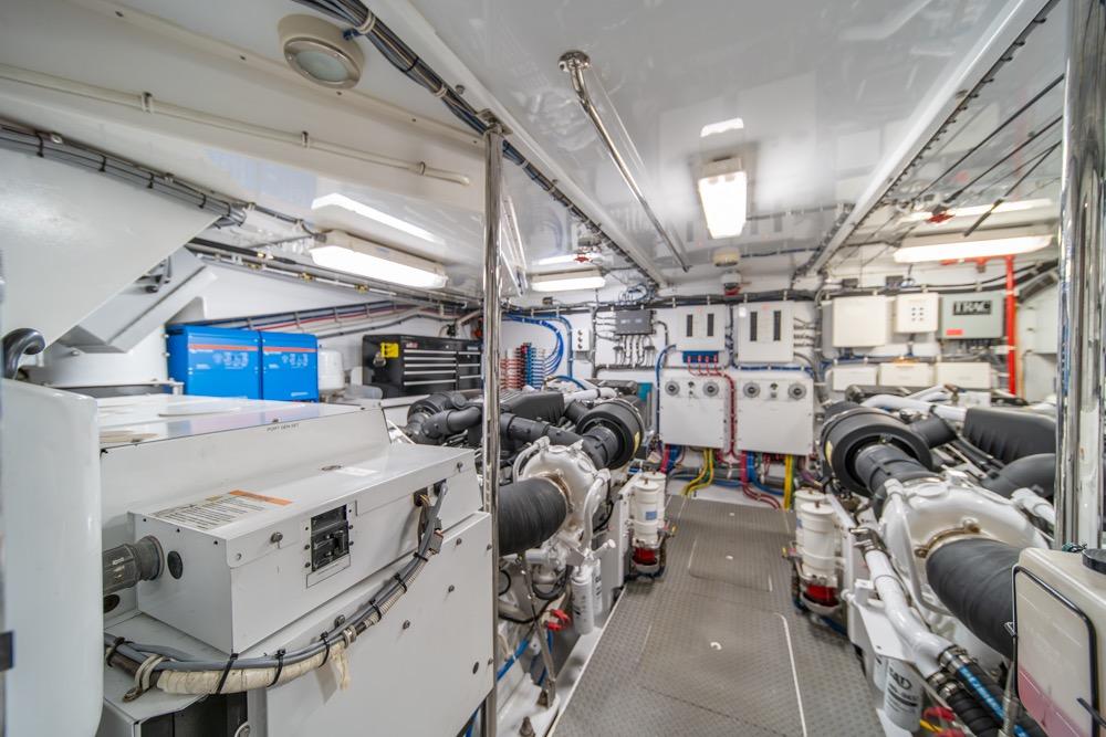 Engine room of 2008 Hatteras 72 Motor Yacht, showcasing machinery and equipment.