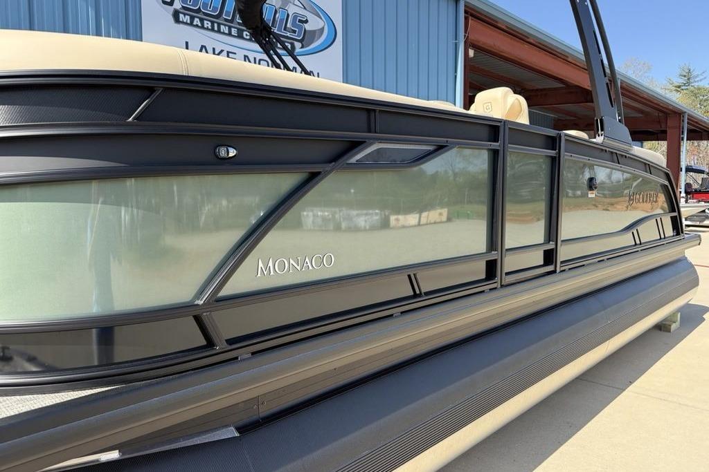 2026 Godfrey Monaco 235 SB pontoon boat at a marina.