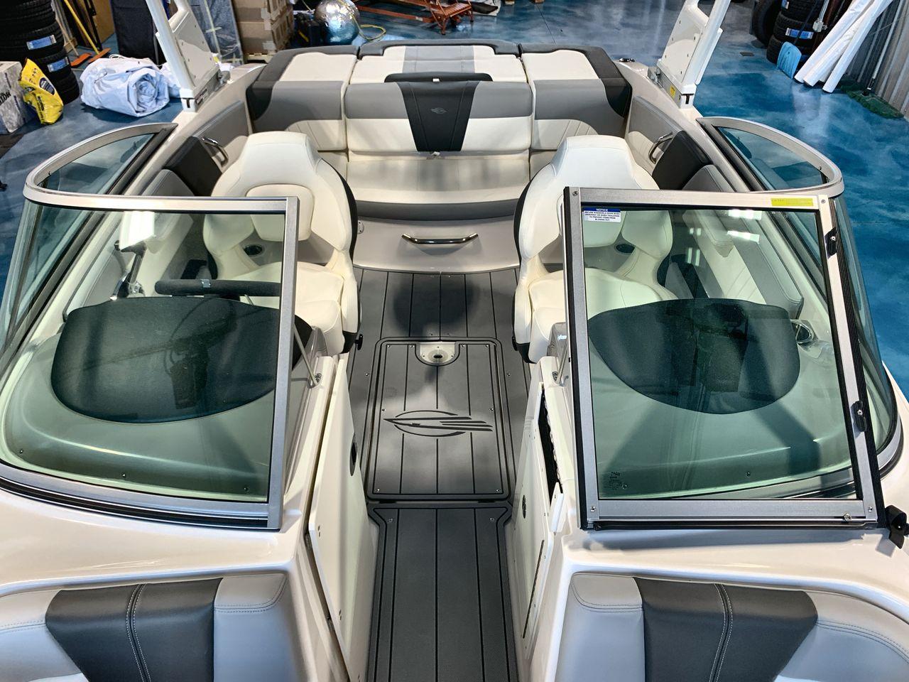 2025 Chaparral 21 SSi boat interior with open windshield and seating area.