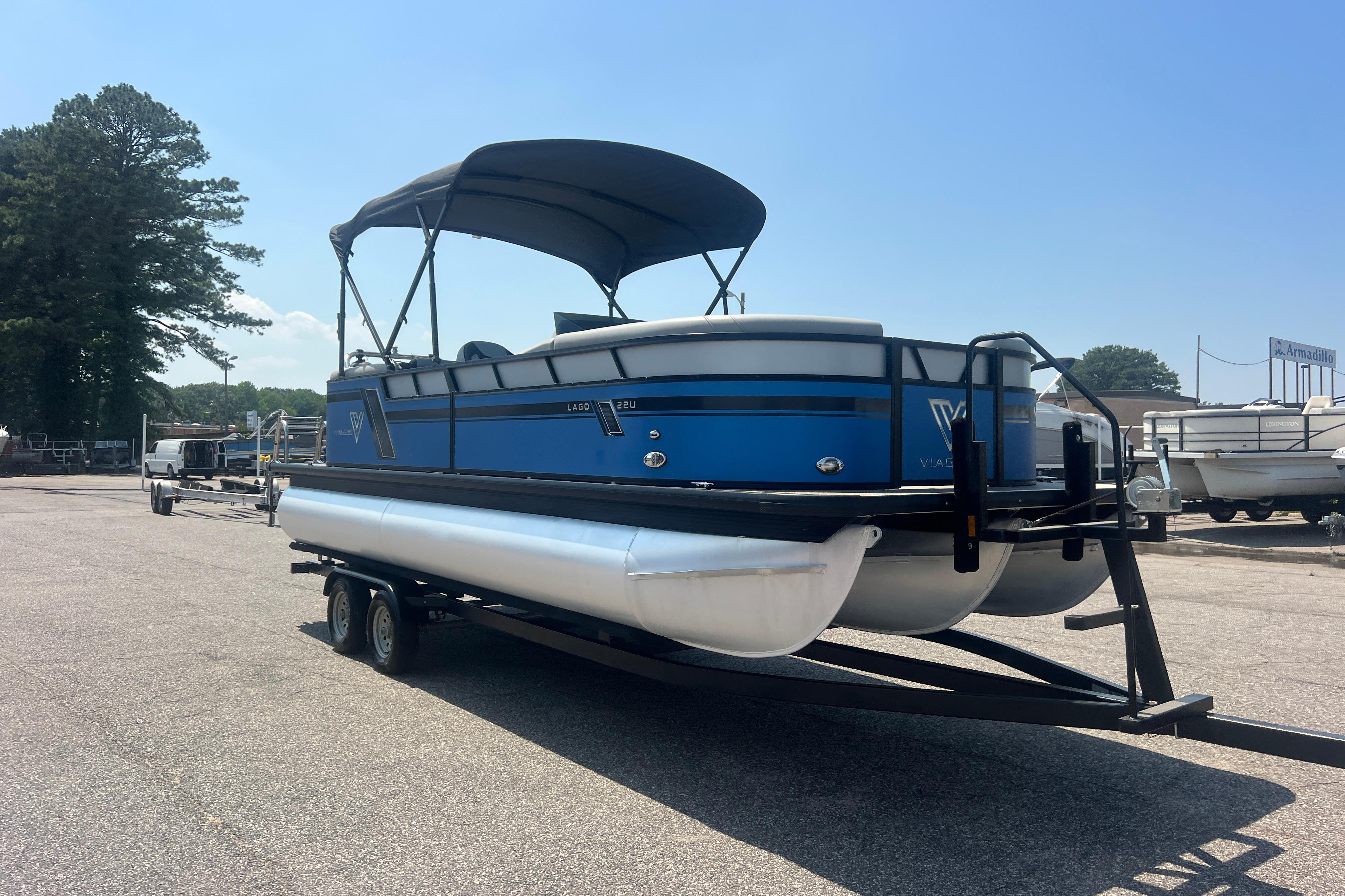 2022 Viaggio Lago V-U 22 pontoon boat on trailer, parked outdoors.