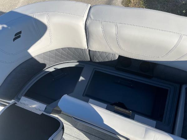2024 Starcraft SLS3 boat interior with gray seating and storage compartment.
