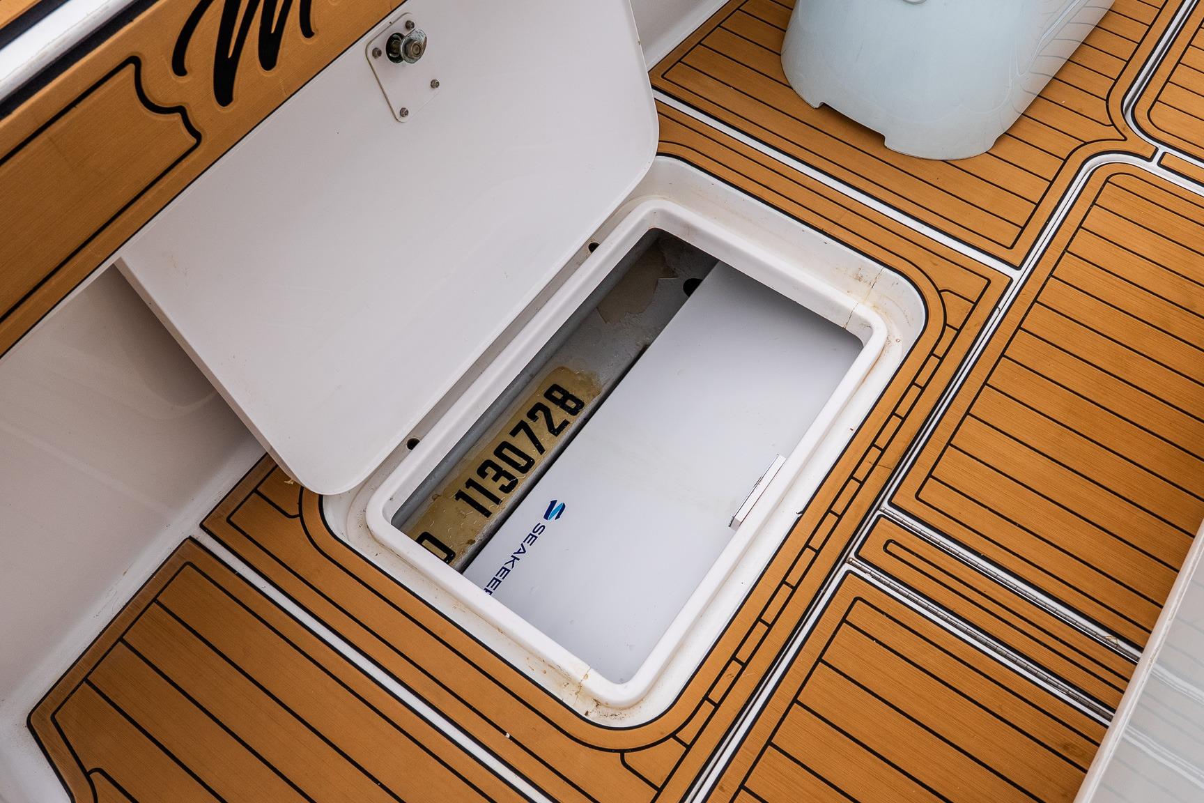 Open hatch on 2002 Viking 61 Enclosed Bridge boat with teak flooring.