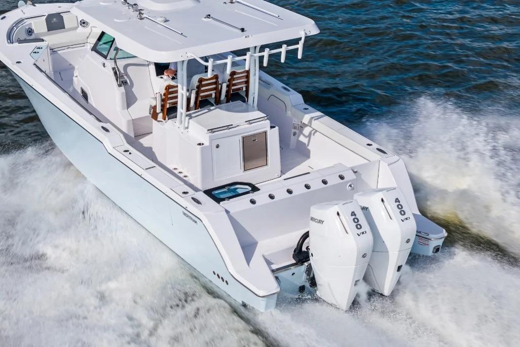 Manufacturer Provided Image: 2026 Bertram 34 CC boat cruising on water with dual Mercury 400 engines.