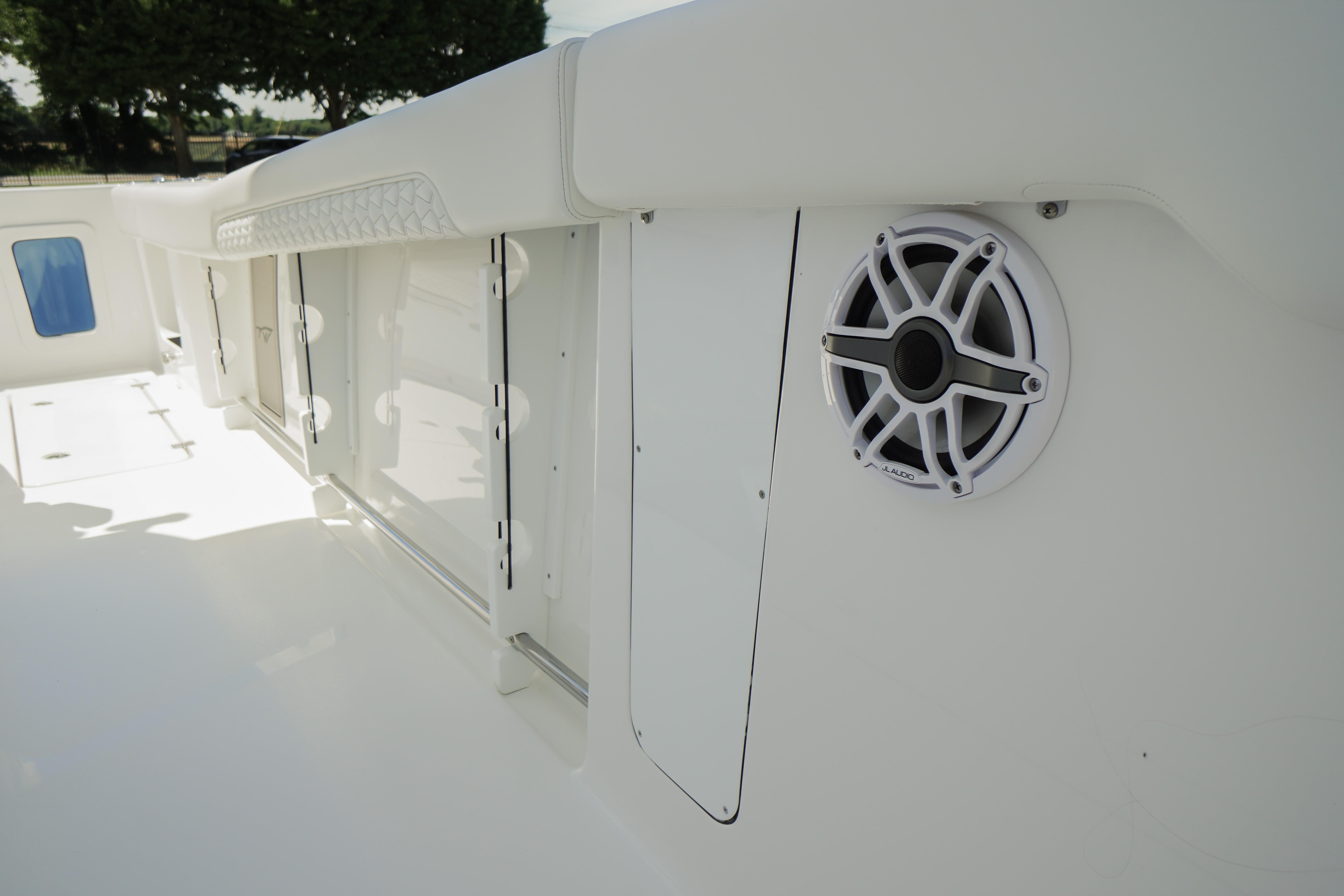 2026 Tidewater 302 CC Adventure boat interior with speaker and storage compartments.