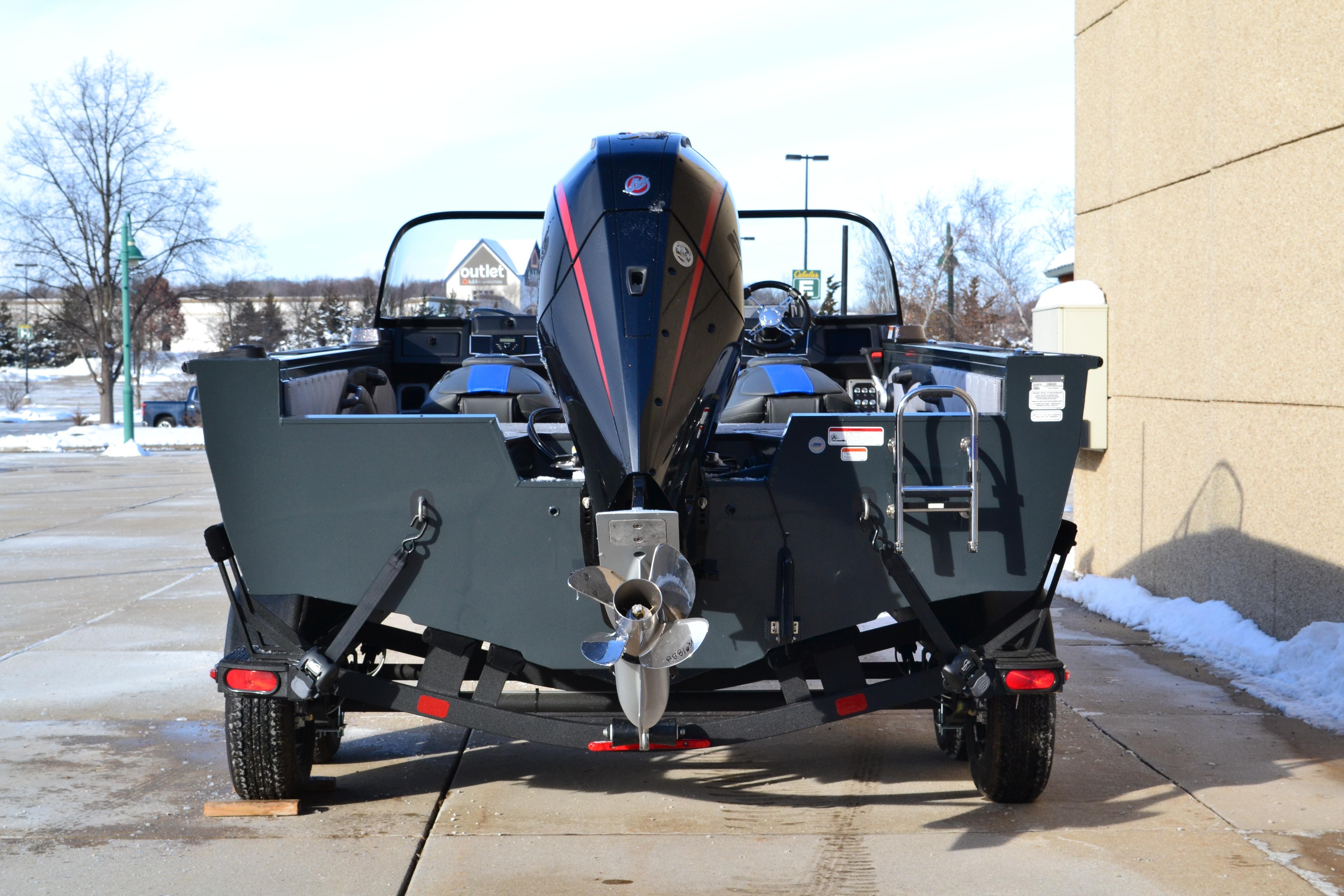 2026 Ranger VX1888 WT boat on trailer, rear view, parked outdoors.