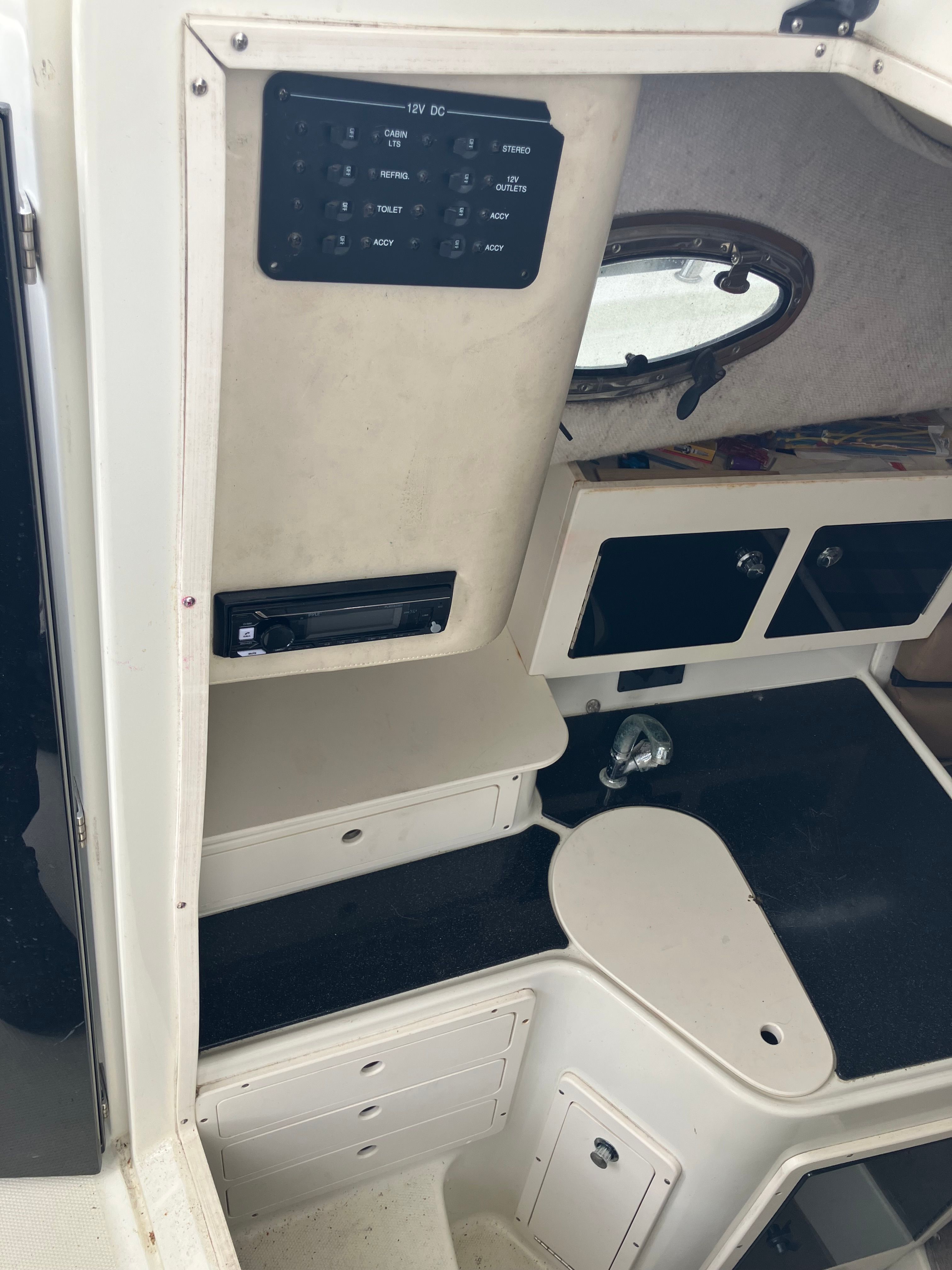 Interior of 2002 Hydra-Sports Vector 2600 WA with controls and storage.