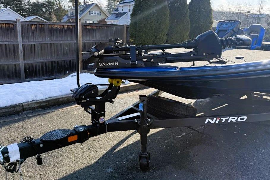 2026 Nitro Z20 XL Pro boat on trailer with Garmin equipment, parked outdoors.