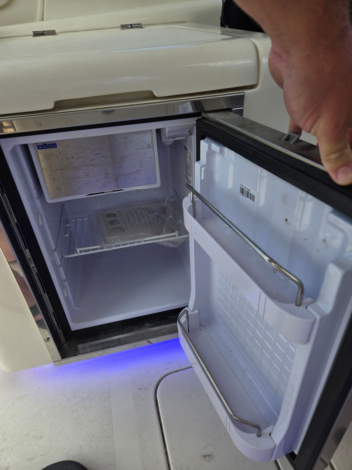 Open refrigerator on a 2019 Scout 275 Dorado boat.