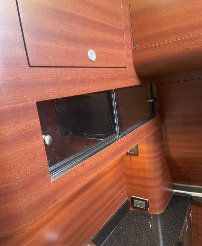 2017 Mystic Powerboats M4200 interior with wood finish and black countertop.