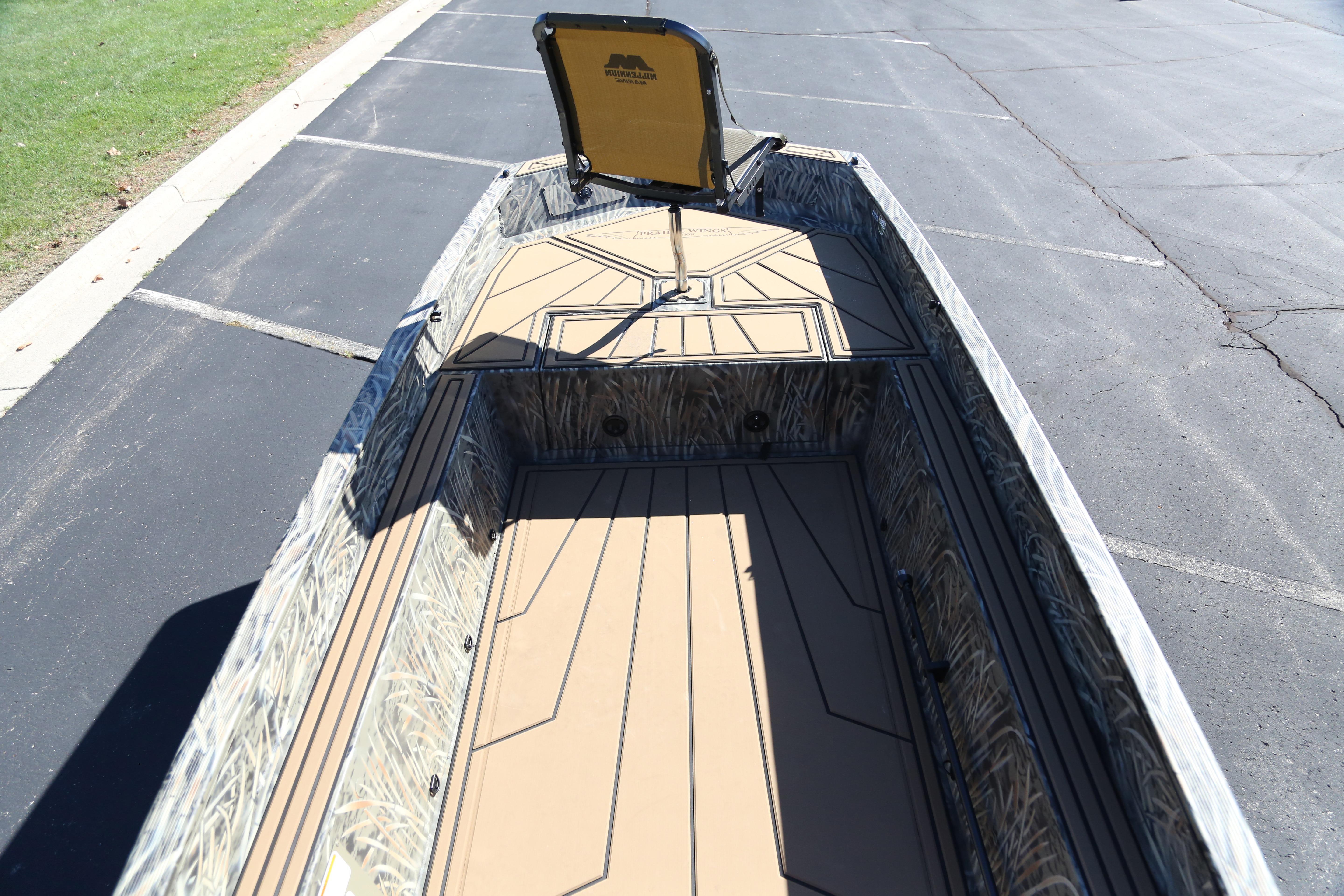 2026 Tracker Grizzly 1650 T Prairie Wings Edition boat interior with camo design.