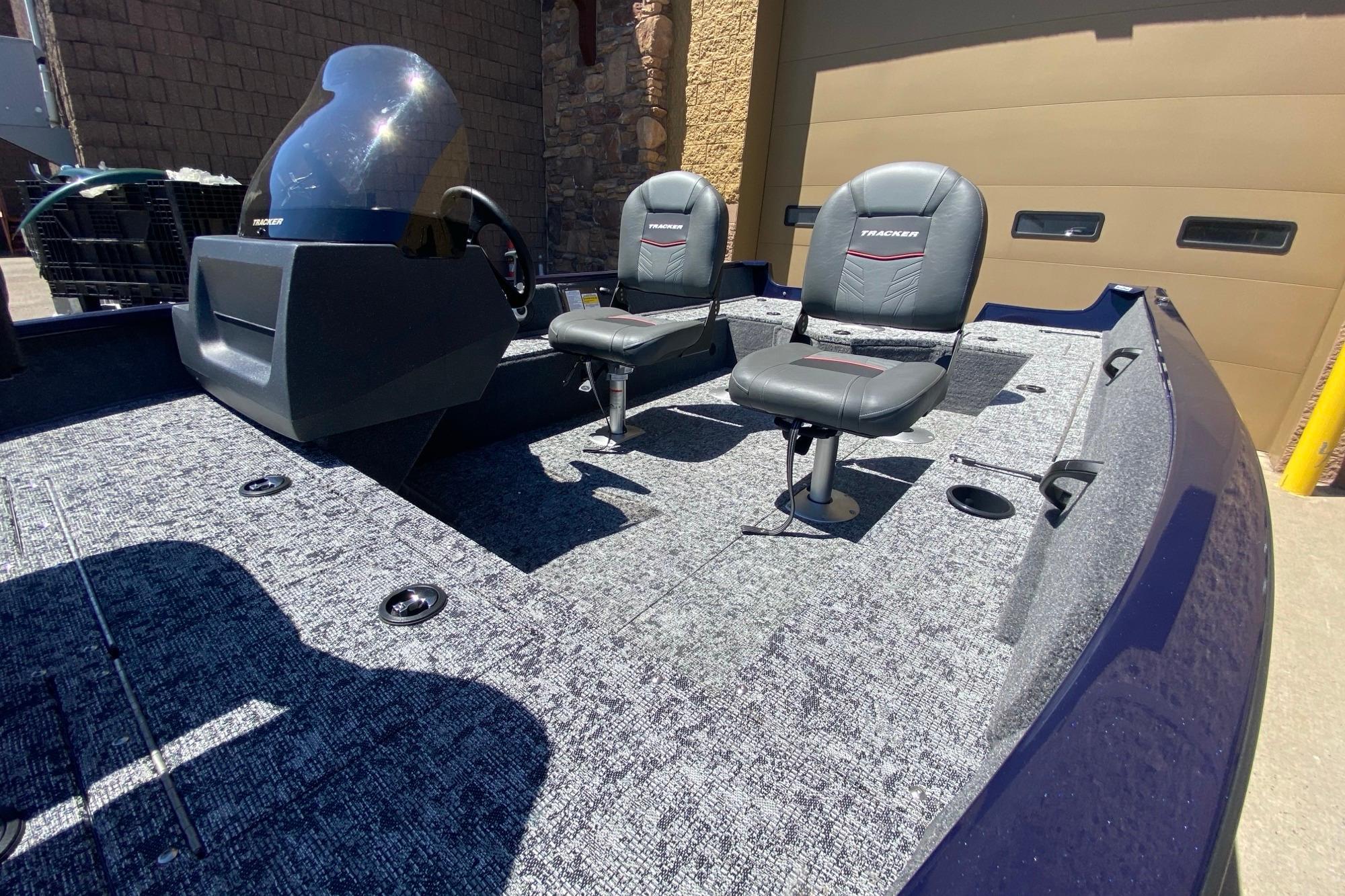 2026 Tracker Pro Guide V-16 SC boat interior with two seats and console.
