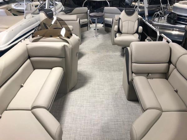 2023 South Bay 224RS LE 2.75 pontoon boat interior with beige seating and modern design.