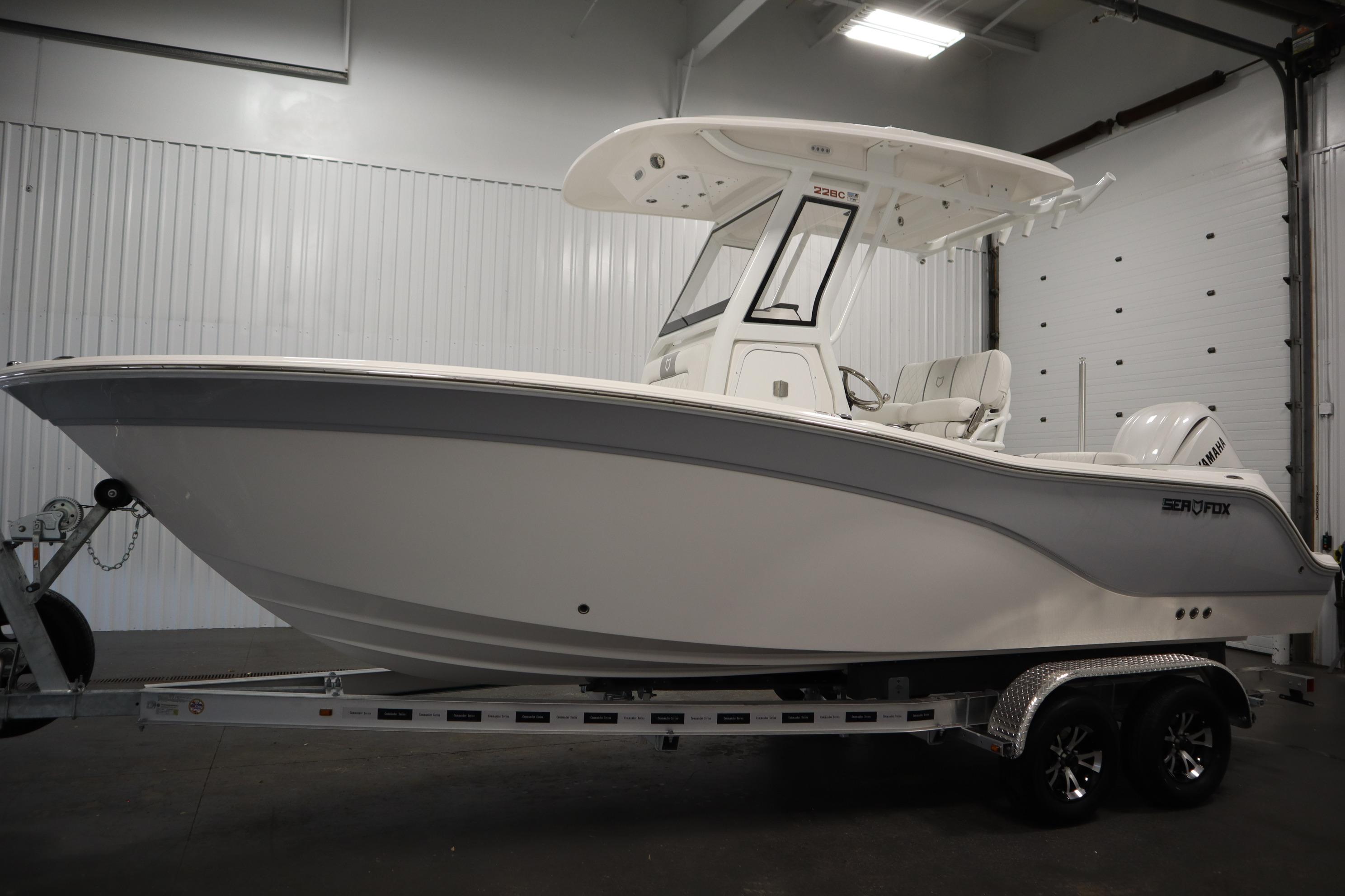 2026 Sea Fox 228 Commander boat on trailer in indoor storage.