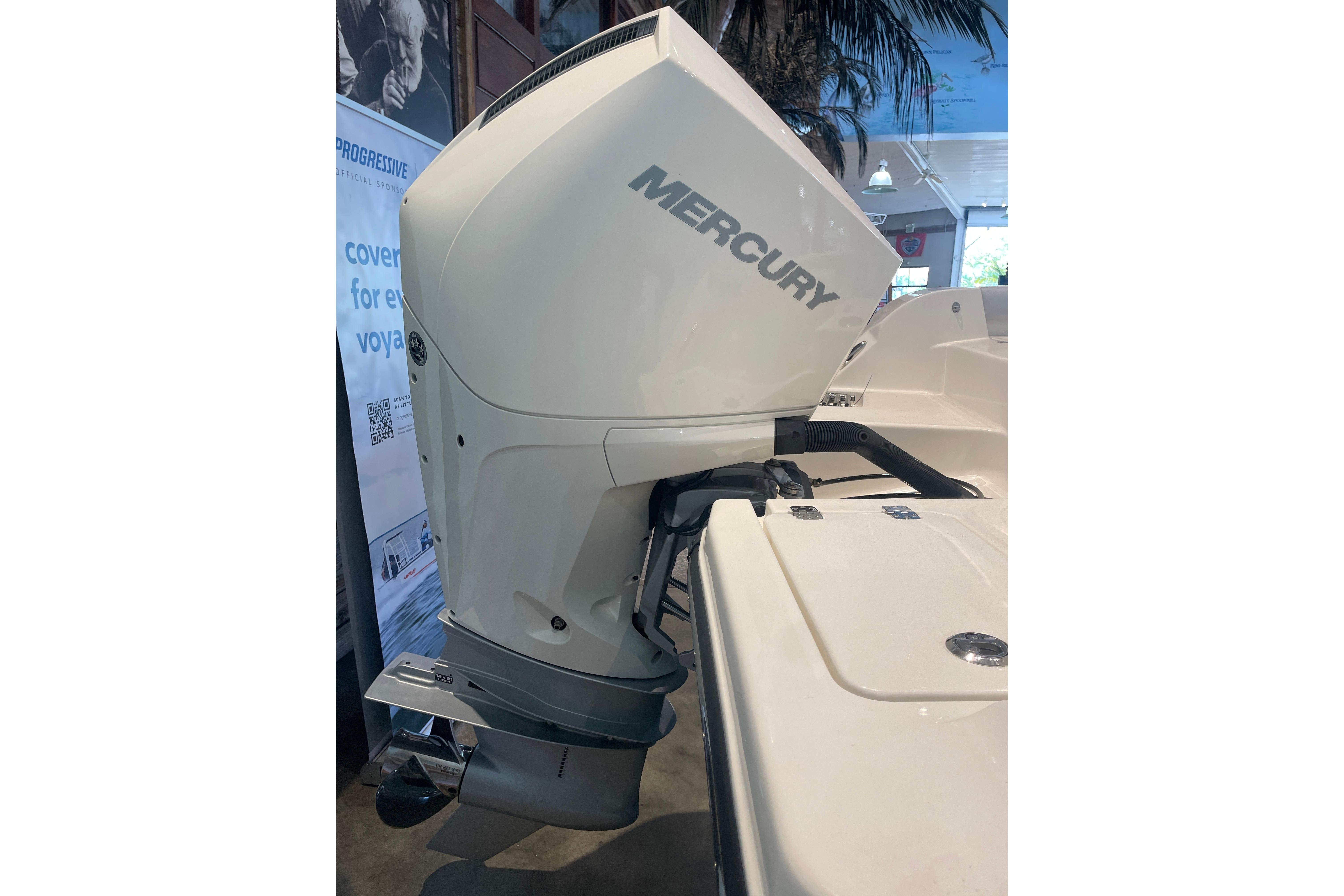 2026 Mako 226 Center Console with Mercury outboard motor in showroom display.