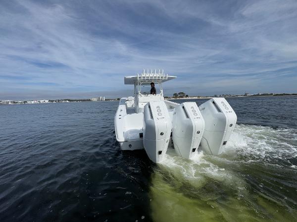 2025 Yellowfin 39 Offshore boat with triple engines cruising on open water.
