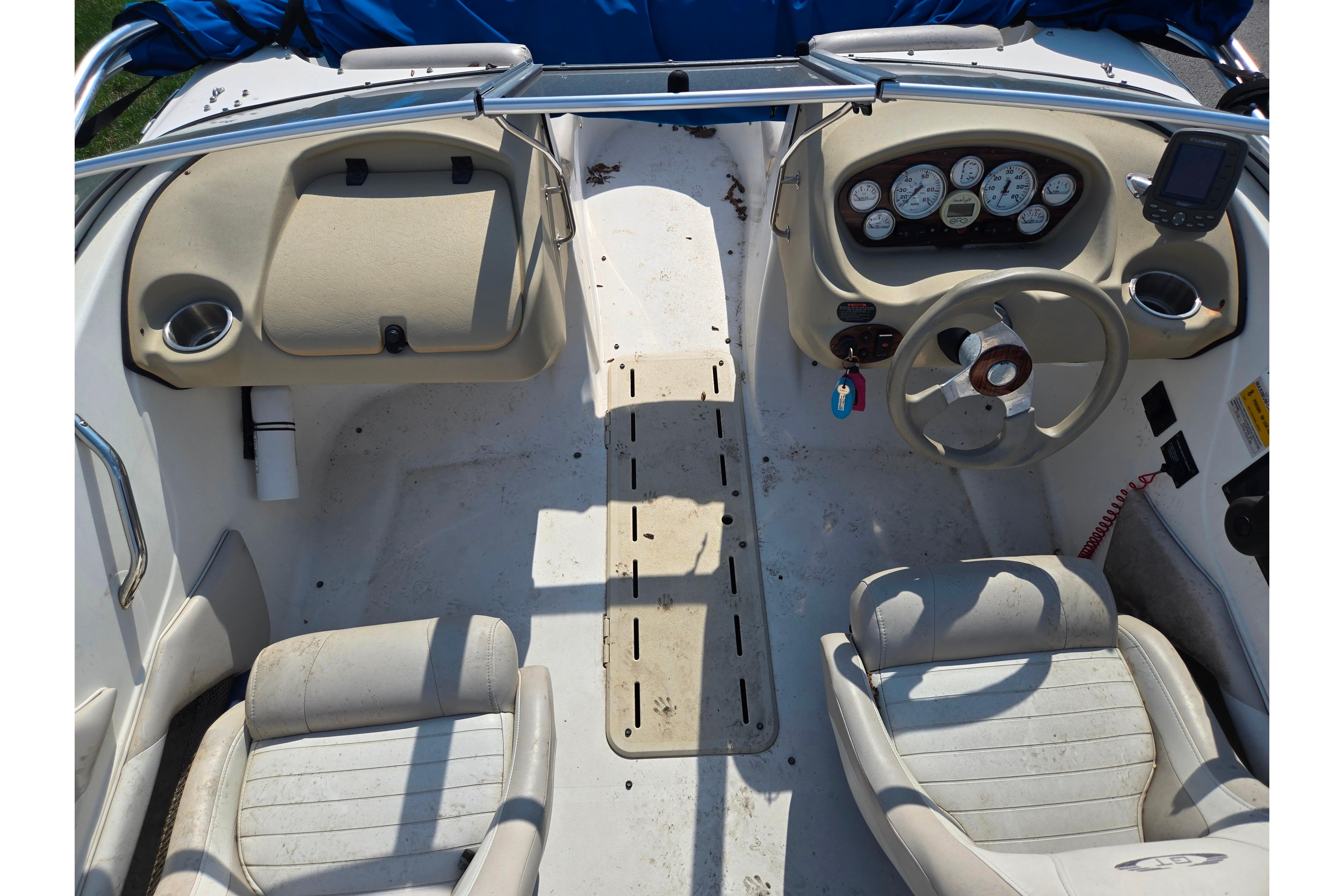Interior of a 2007 Glastron GT 185 boat showing dashboard and seating.