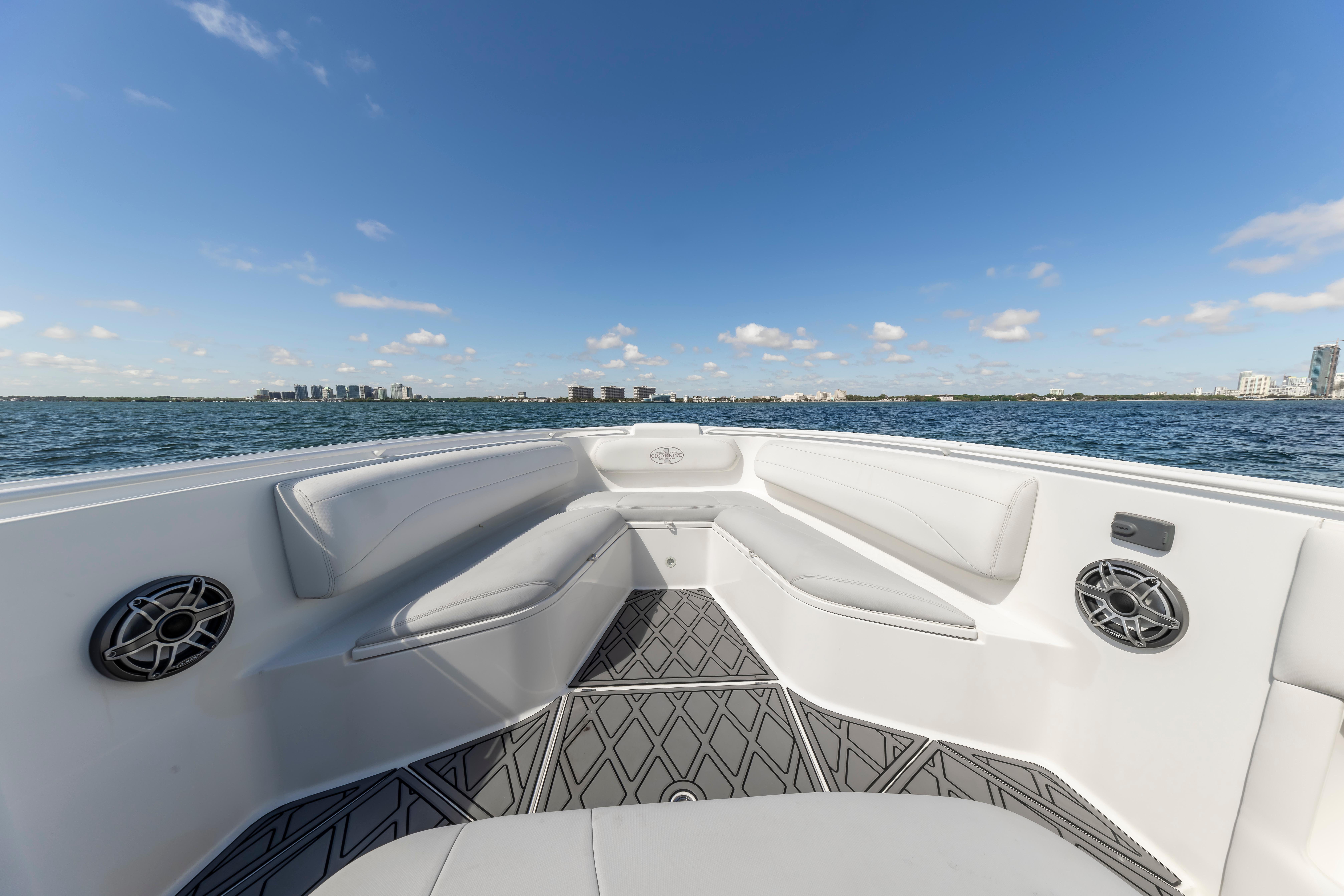 2016 Cigarette 41 GTR boat interior with seating, speakers, and ocean view.