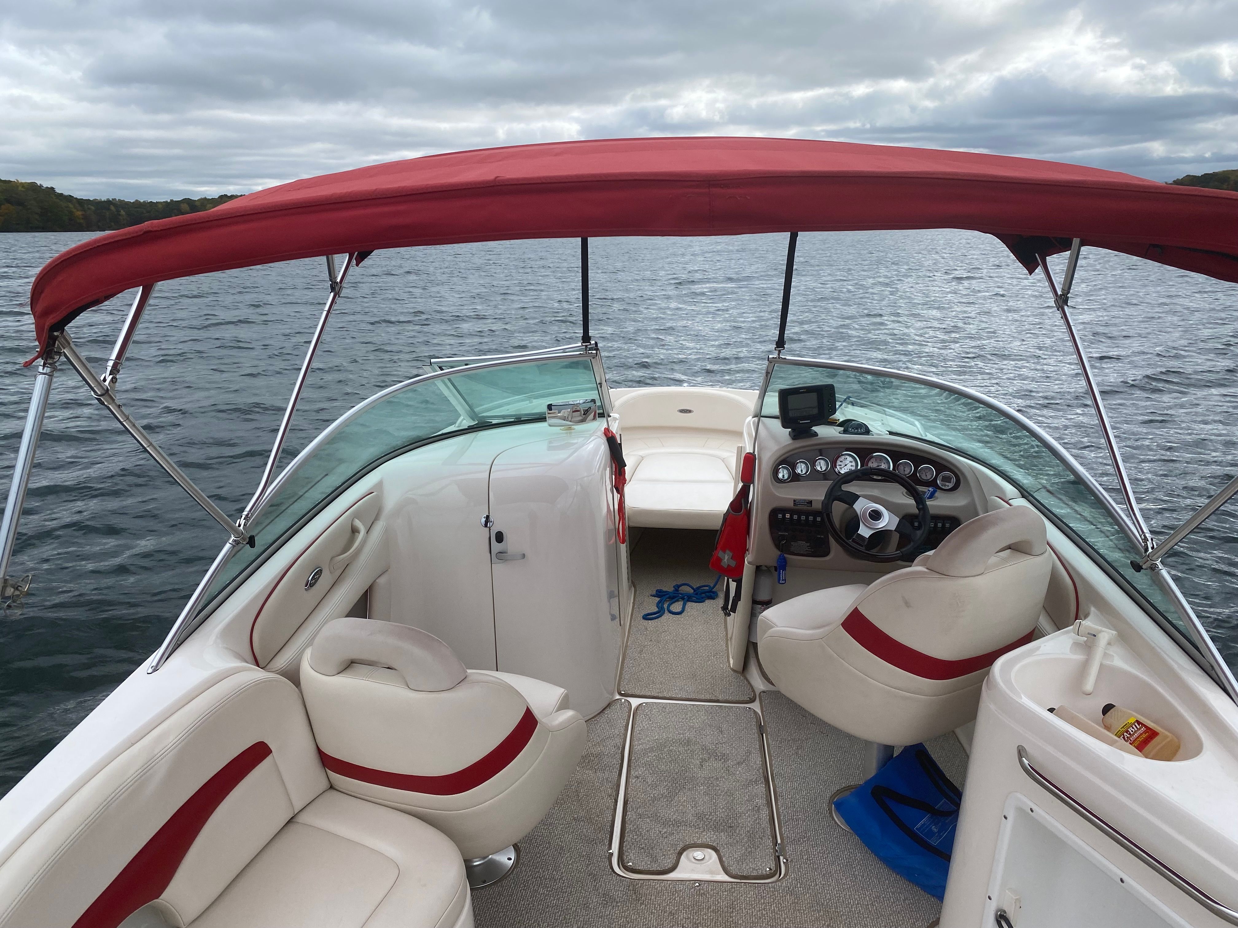 2000 Chaparral 230 SSi boat on a lake.