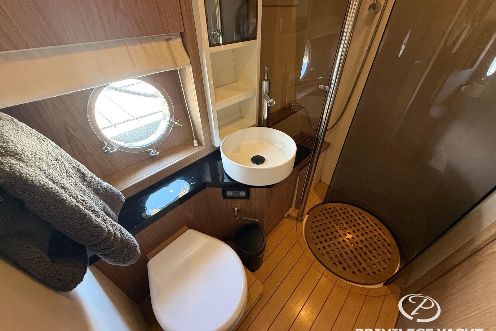 Luxurious bathroom in 2009 Sessa Marine C52 yacht with modern fixtures and wooden accents.