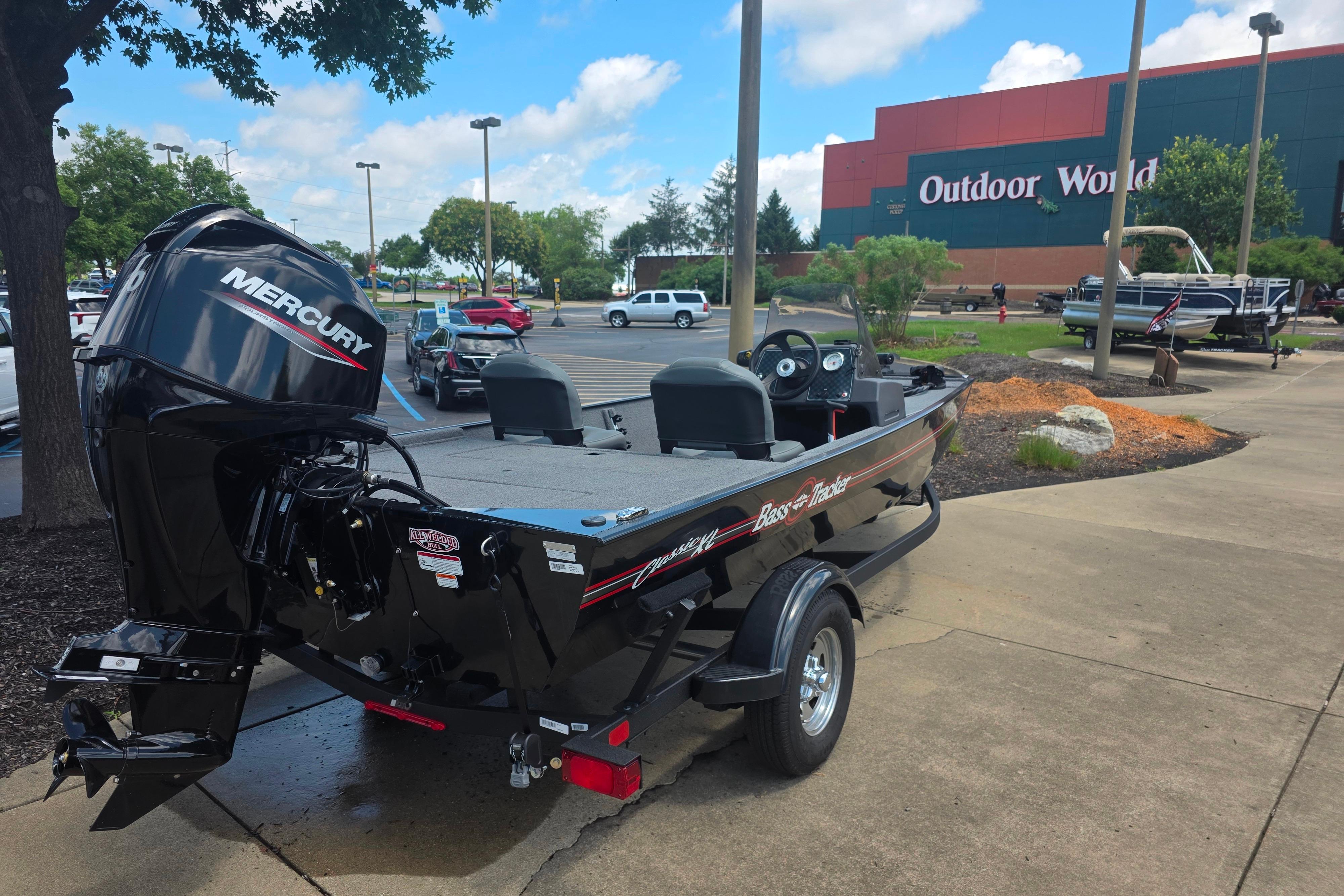 2026 Tracker Bass Tracker Classic XL boat with Mercury engine at Outdoor World parking lot.