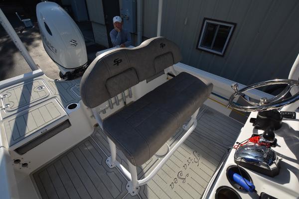 2021 Sea Pro 228 Bay boat interior with seating and controls.