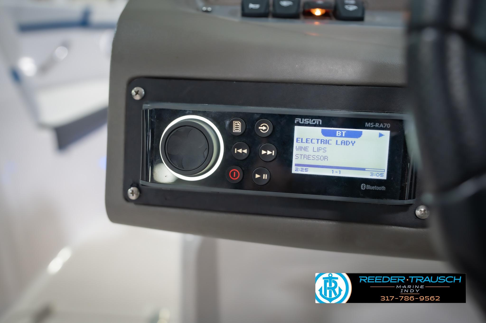 Close-up of a Fusion MS-RA70 stereo on a 2015 Regal 2000 ESX Bowrider boat.