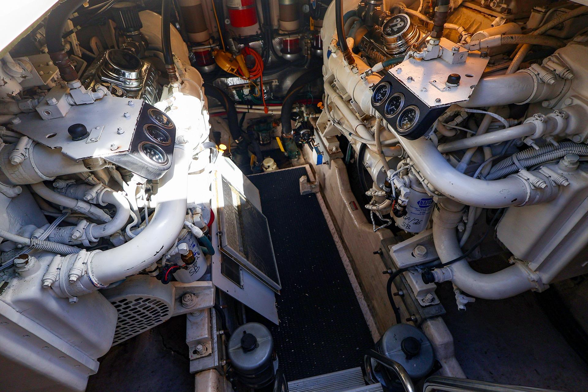 Engine room of a 1998 Sea Ray 500 Sundancer yacht, showcasing dual engines.