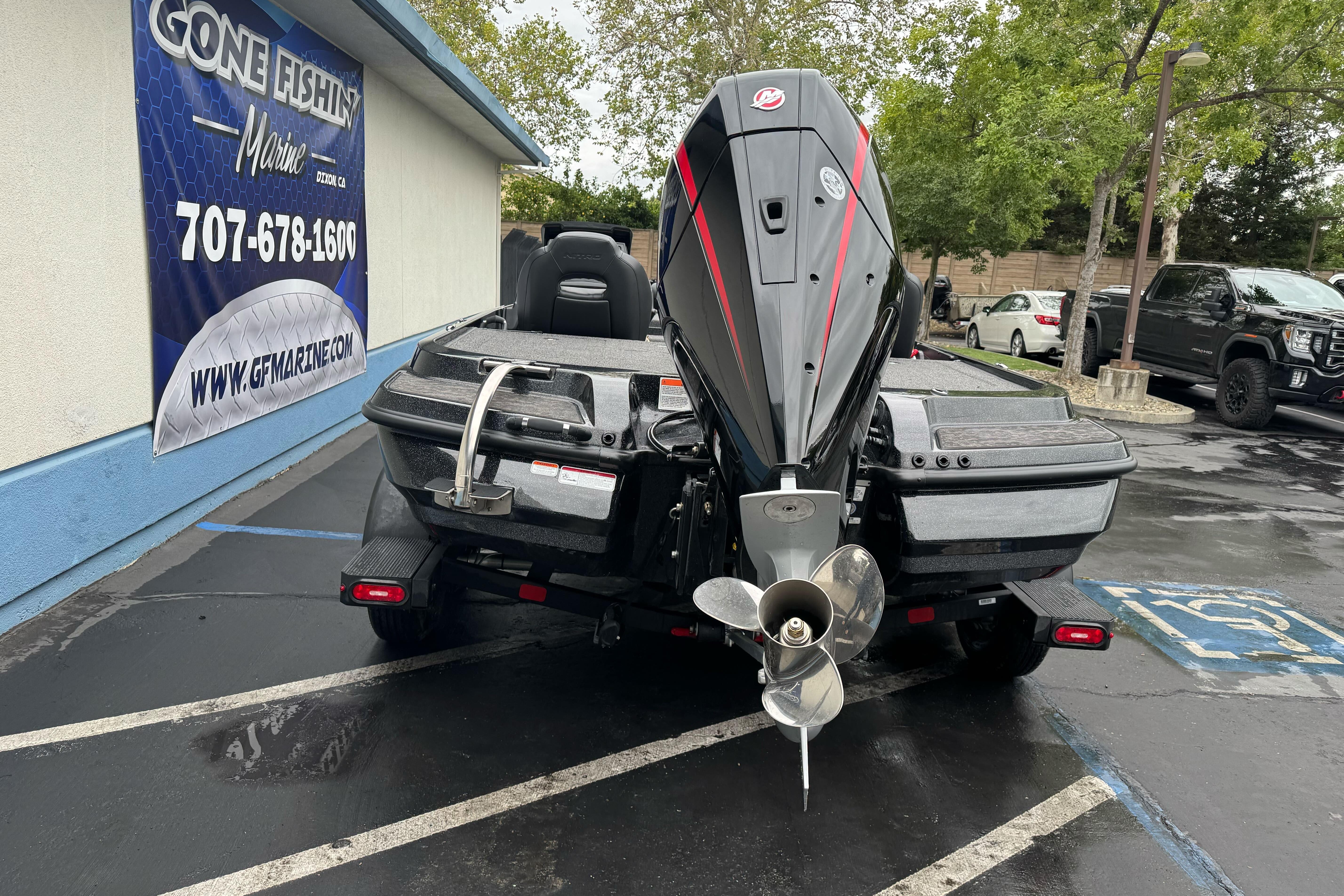 2026 Nitro Z20 XL Pro boat parked at dealership with banner in background.