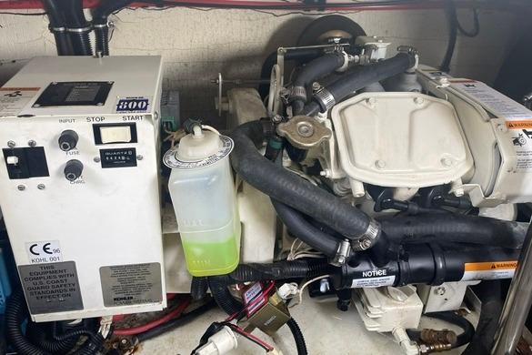 Engine compartment of a 1999 Formula 400 Super Sport boat, featuring mechanical components.