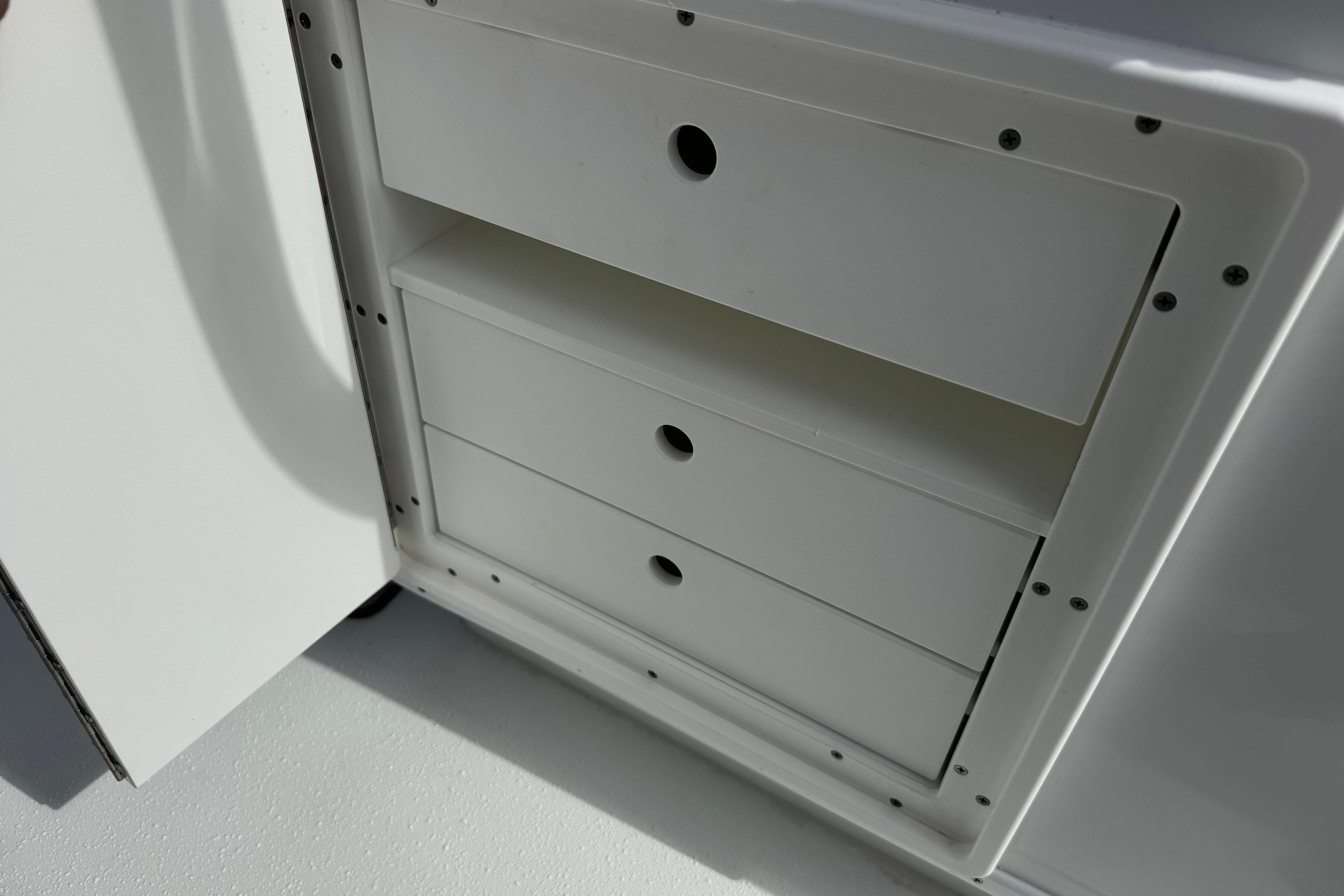 White storage drawers on a 2022 Yellowfin 32 Offshore boat.