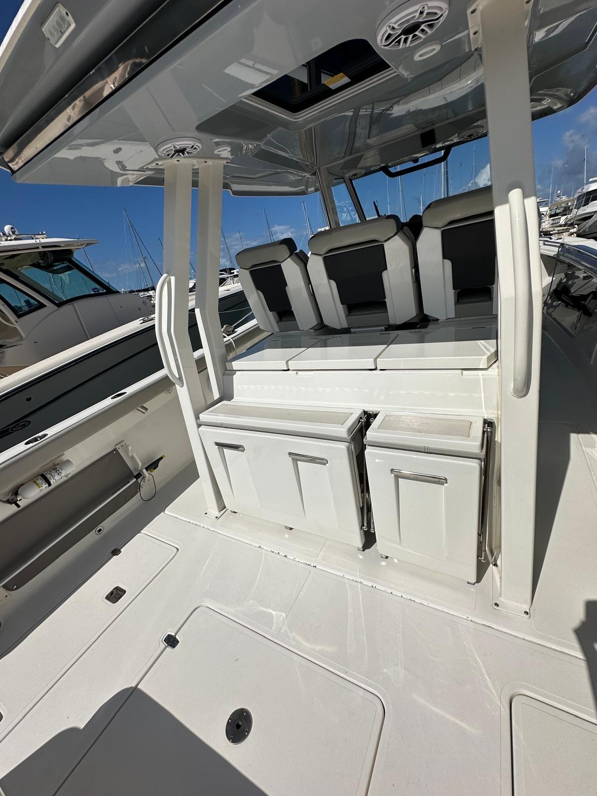 2023 Pursuit S 358 Sport boat interior with seating and storage.