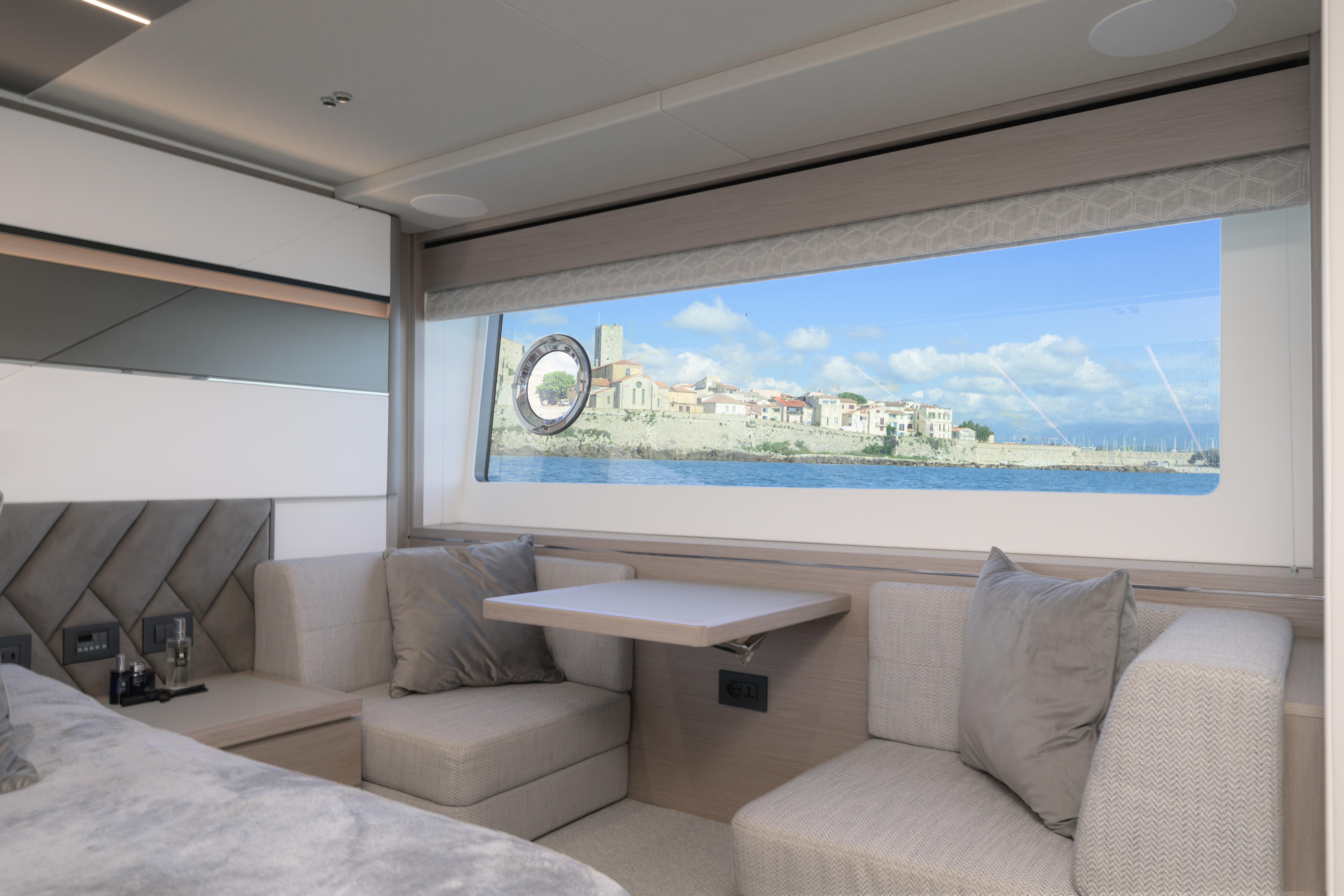 Luxurious interior of 2024 Sunseeker 75 Sport Yacht with scenic ocean view.