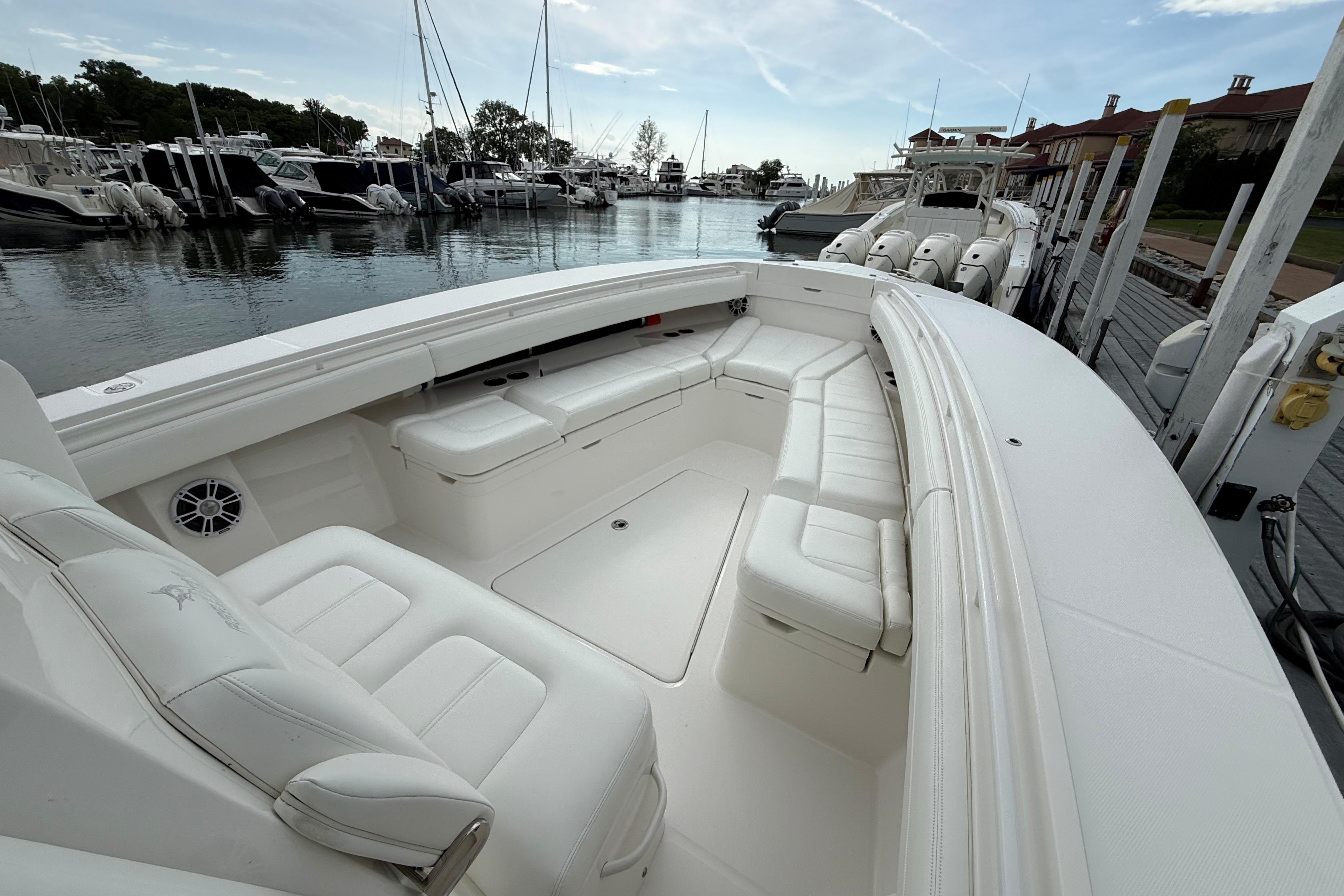 2021 Regulator 31 boat with spacious white seating at a marina.