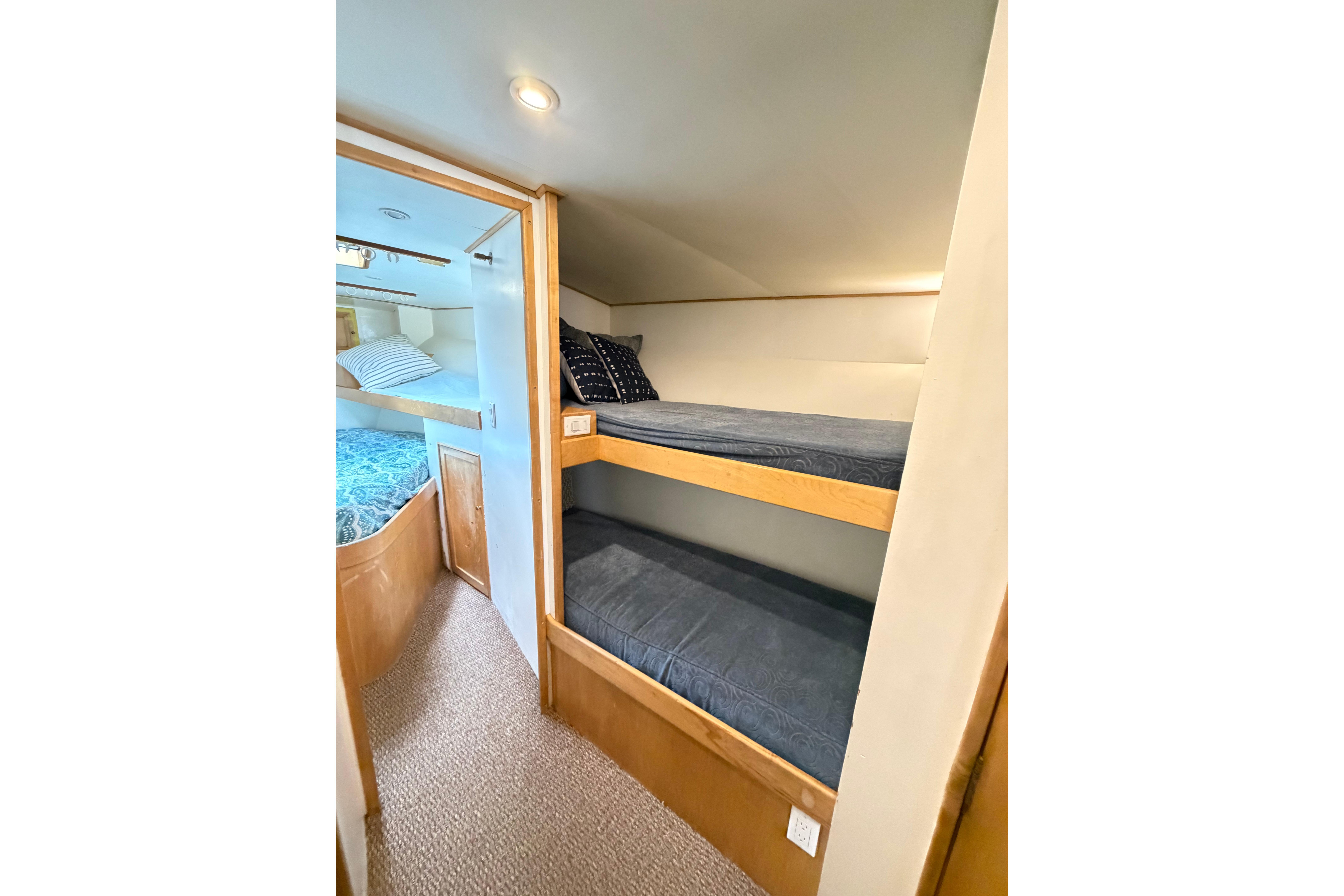 1998 Blackwell Custom Carolina Sportfish interior with cozy bunk beds and nautical decor.