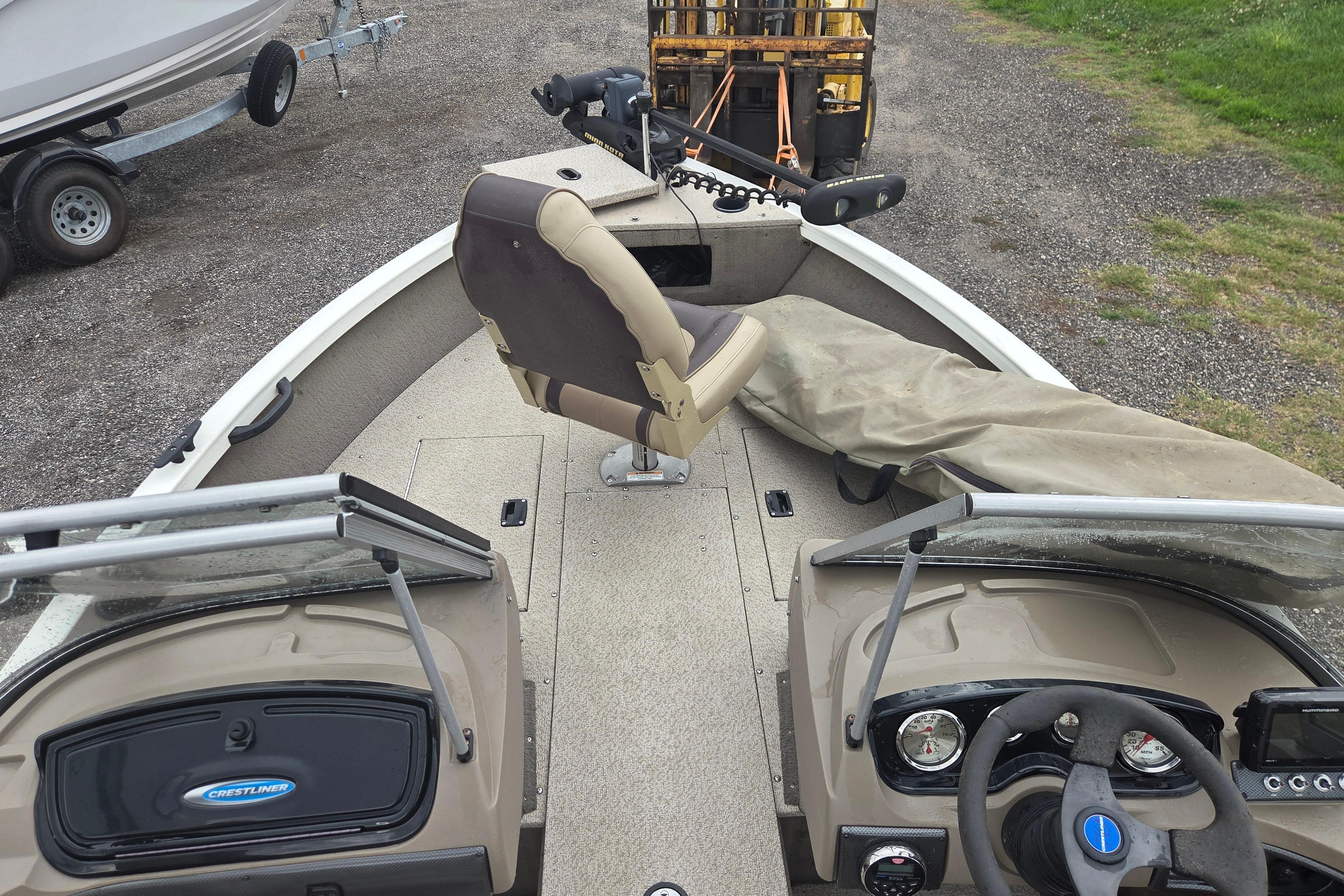2016 Crestliner 1650 Fish Hawk SC boat interior with steering wheel and seating.