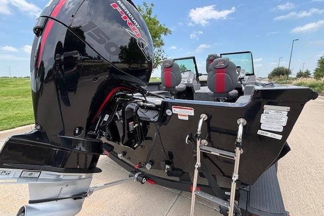 2026 Ranger VS1782SC Angler boat with powerful outboard motor, parked on a sunny day.