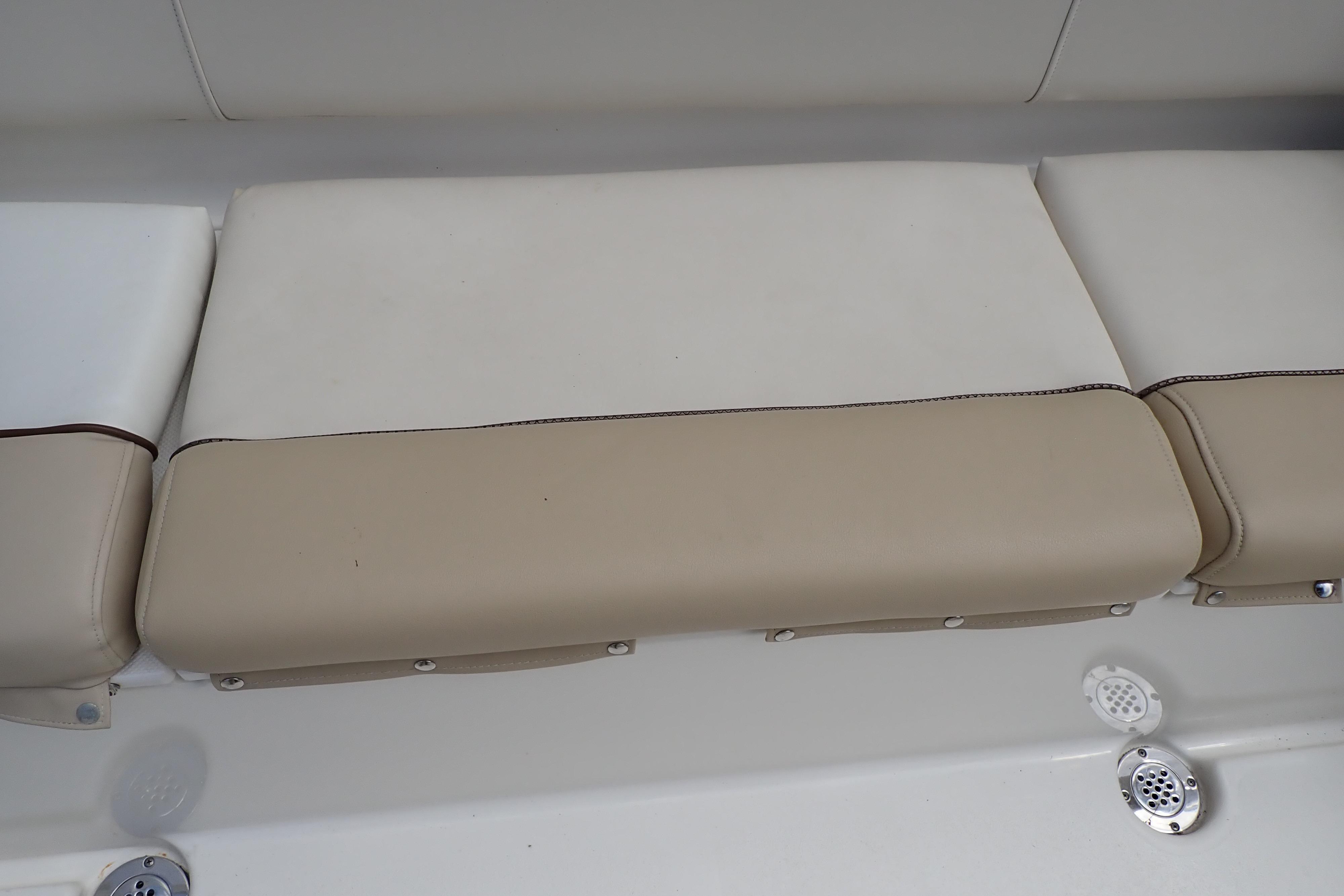 2019 Key West 263 FS boat seat with beige and white upholstery.