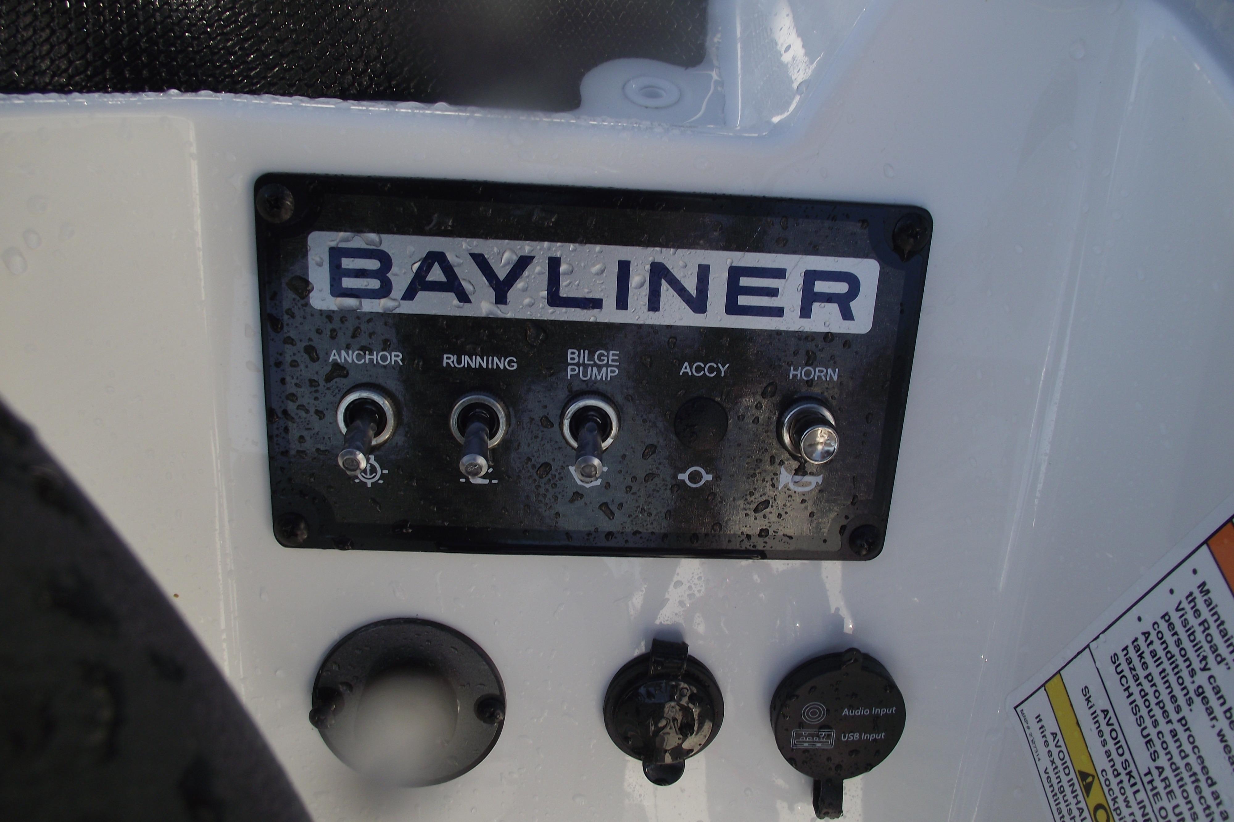 Control panel of 2026 Bayliner M19 boat with switches and inputs.