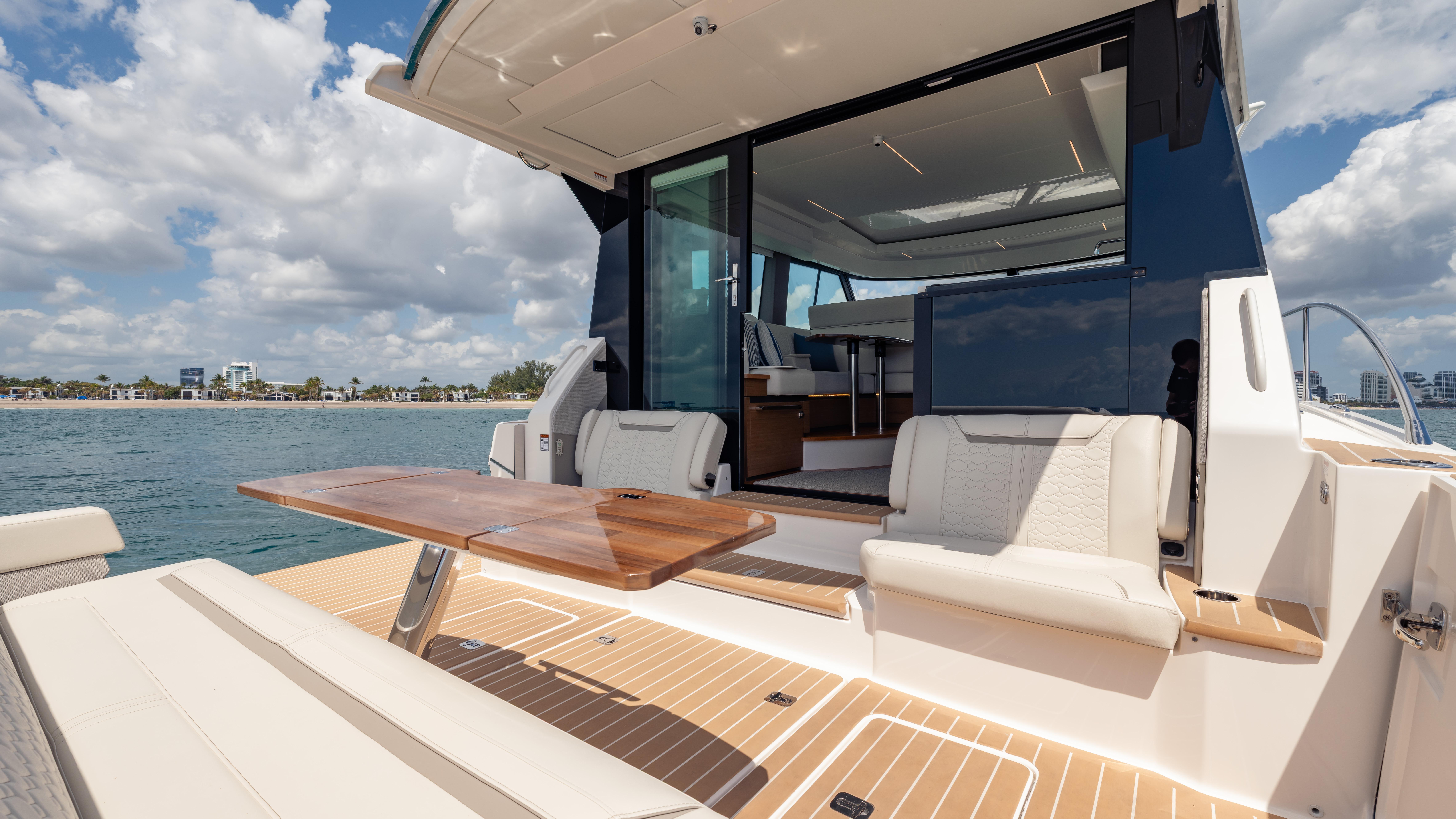 2024 Tiara Yachts 48 LE with open deck, luxurious seating, and ocean view.
