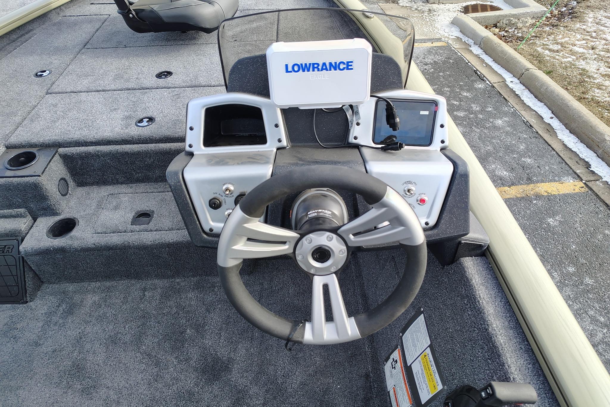 2026 Tracker Pro Team 195 boat dashboard with steering wheel and Lowrance electronics.