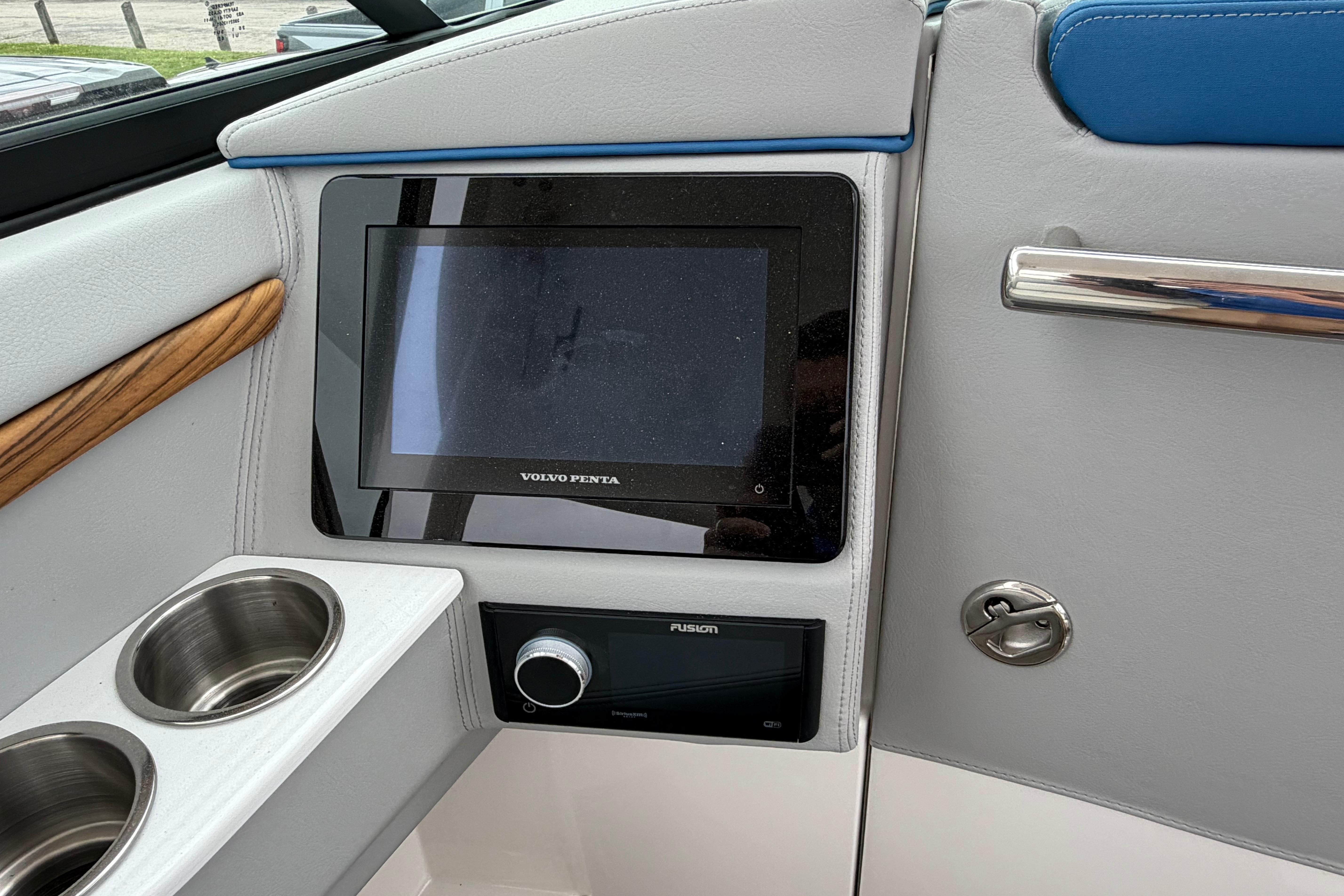 2026 Regal LS9 Surf boat dashboard with Volvo Penta display and Fusion audio system.