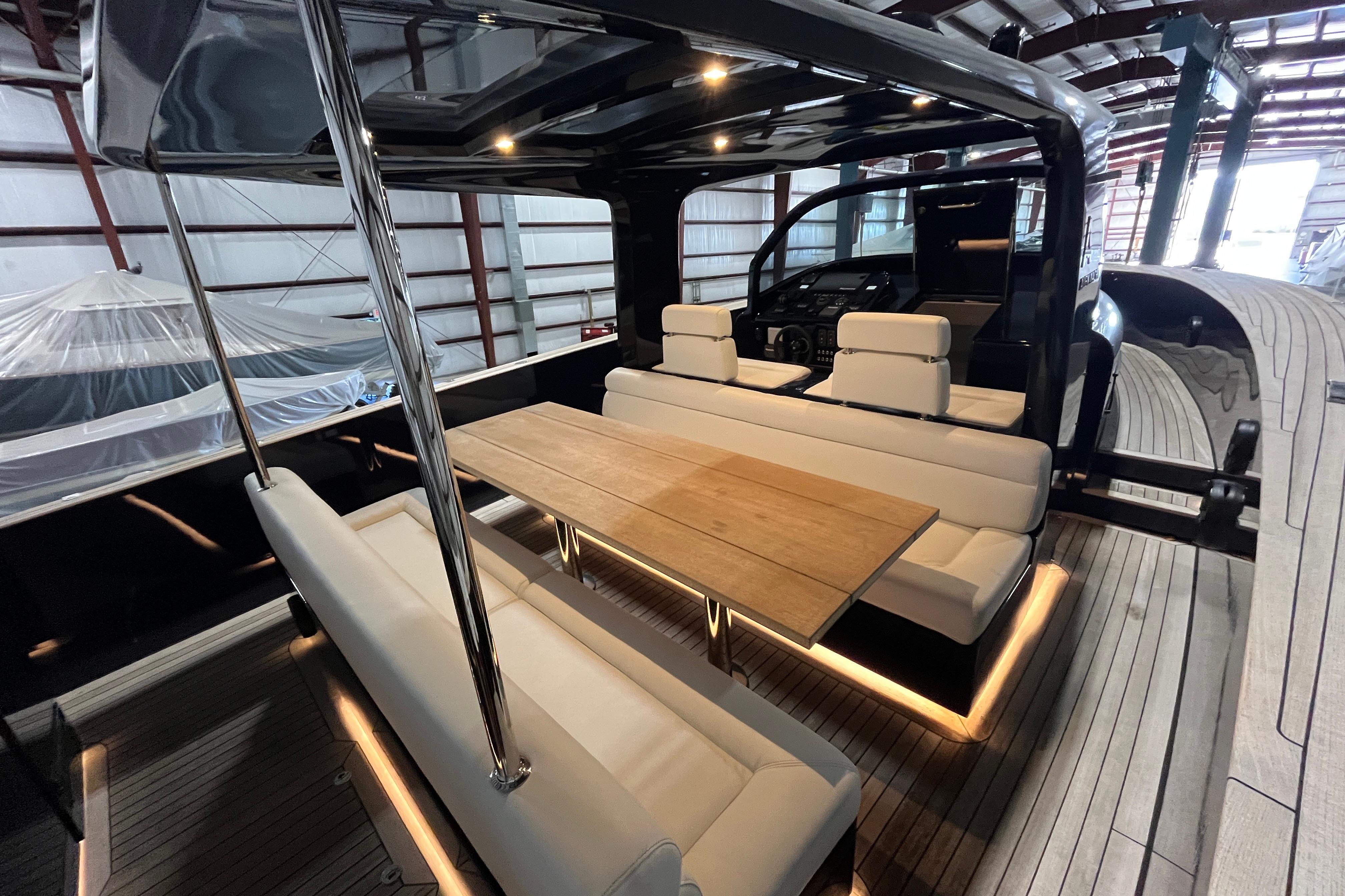 Luxurious 2018 Alen 45 yacht interior with elegant seating and wooden table in a spacious cabin.