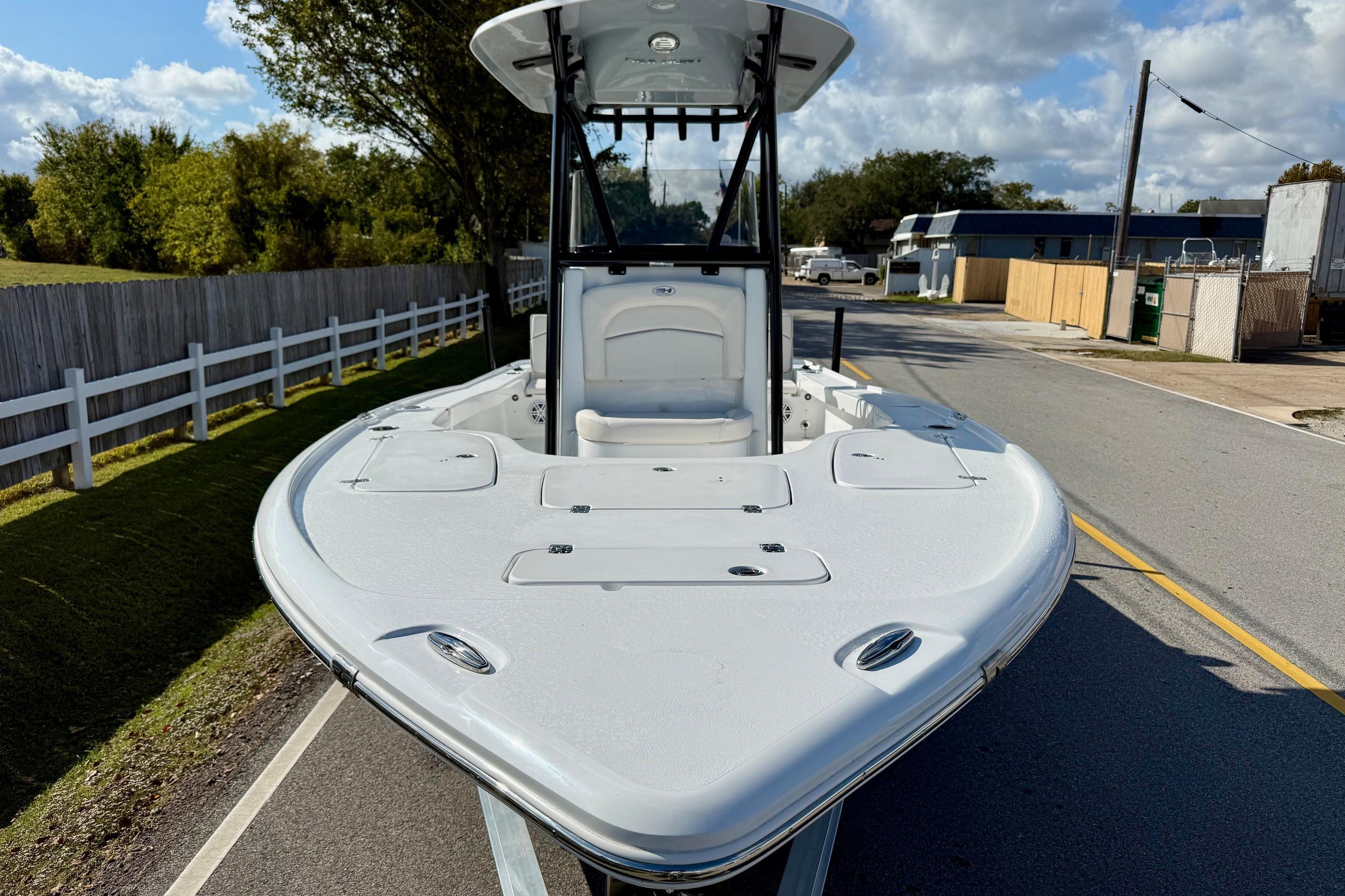 2026 Sea Hunt BX 22 BR boat on a road, showcasing sleek design and spacious deck.
