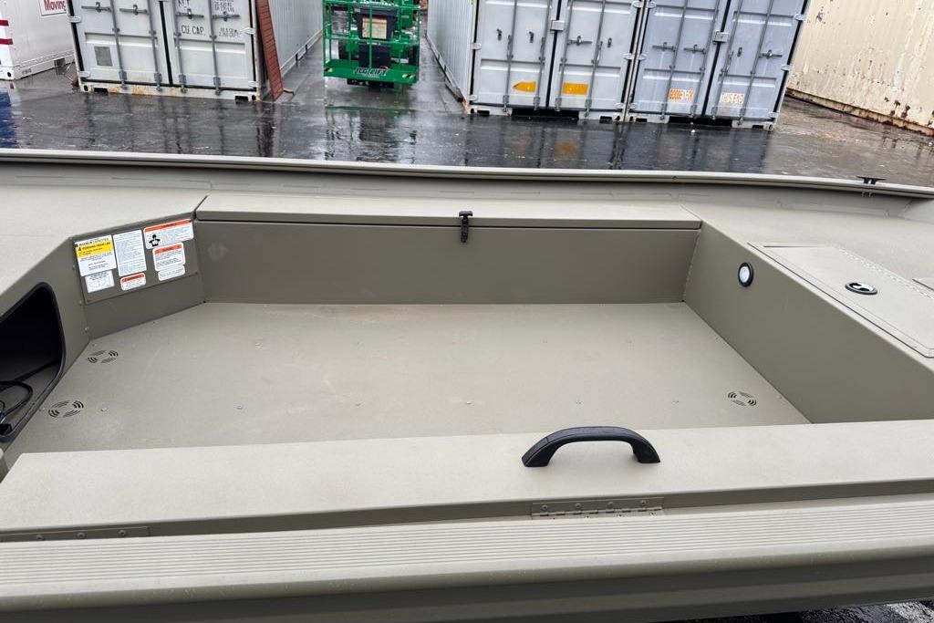2026 Tracker Grizzly 1654 T Sportsman boat interior with storage compartments.