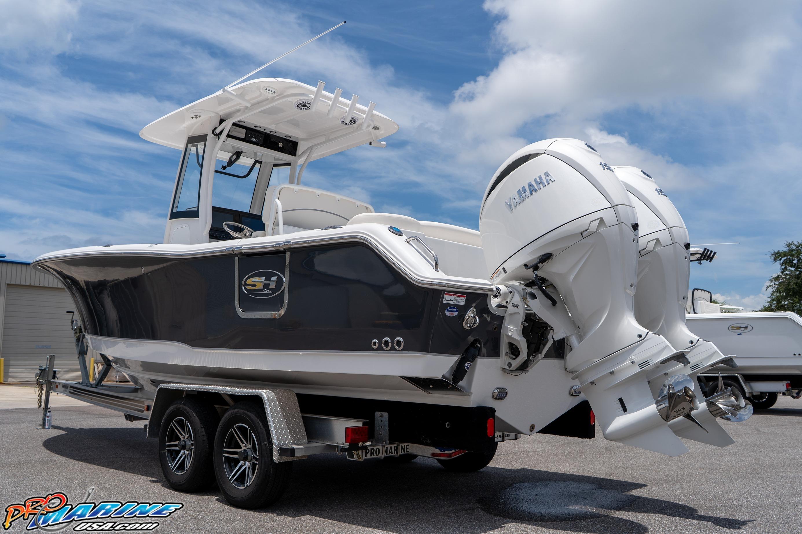 2026 Sea Hunt Ultra 265 SE boat with dual Yamaha engines on a trailer.