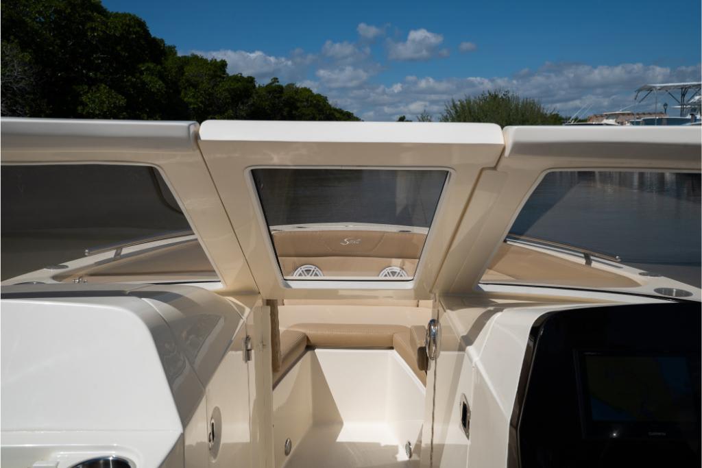 2023 Scout 240 Dorado boat interior with clear windshield and seating area.