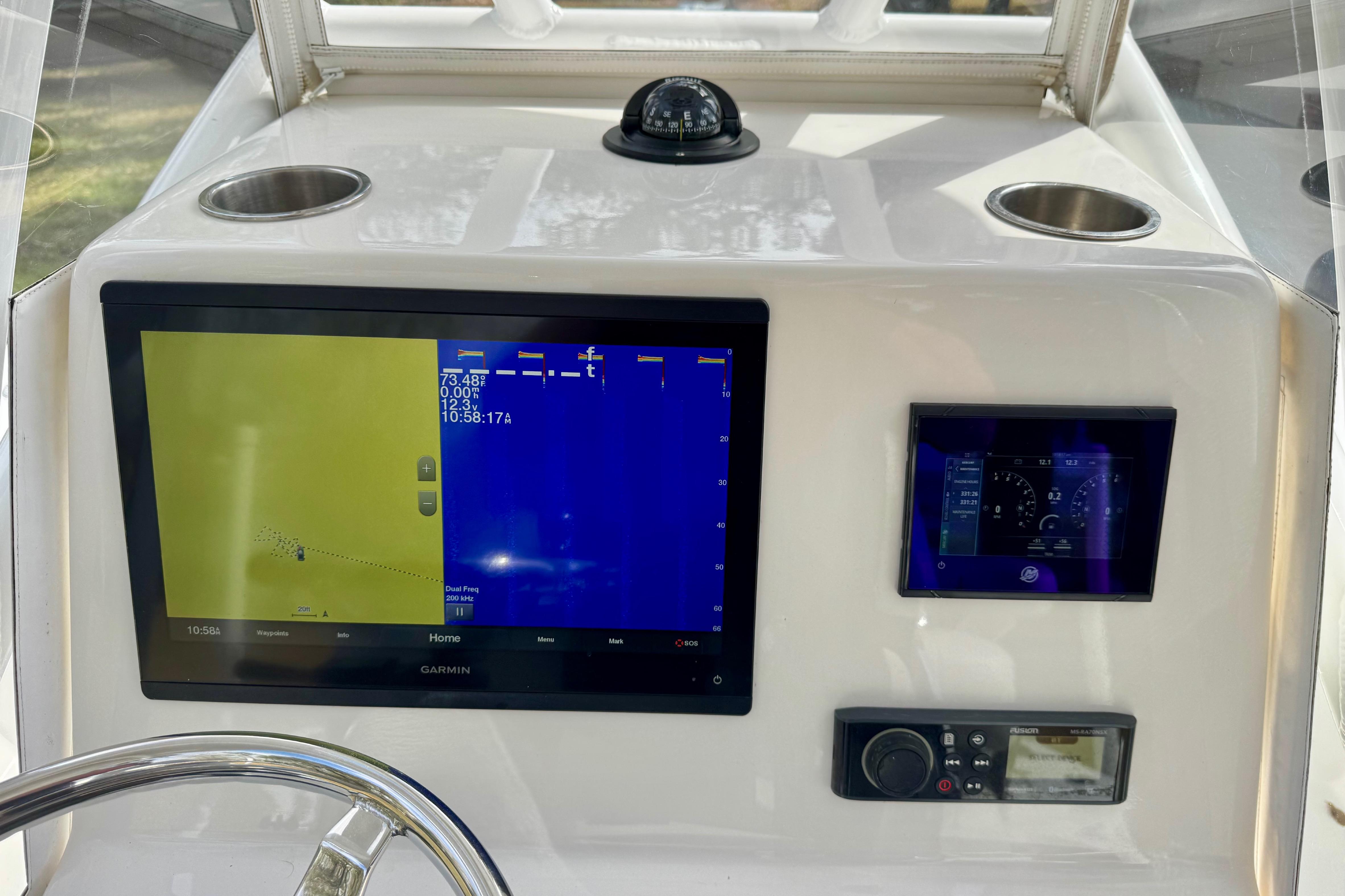 Dashboard of 2021 ZCB 26 Freemason boat with navigation and control screens.