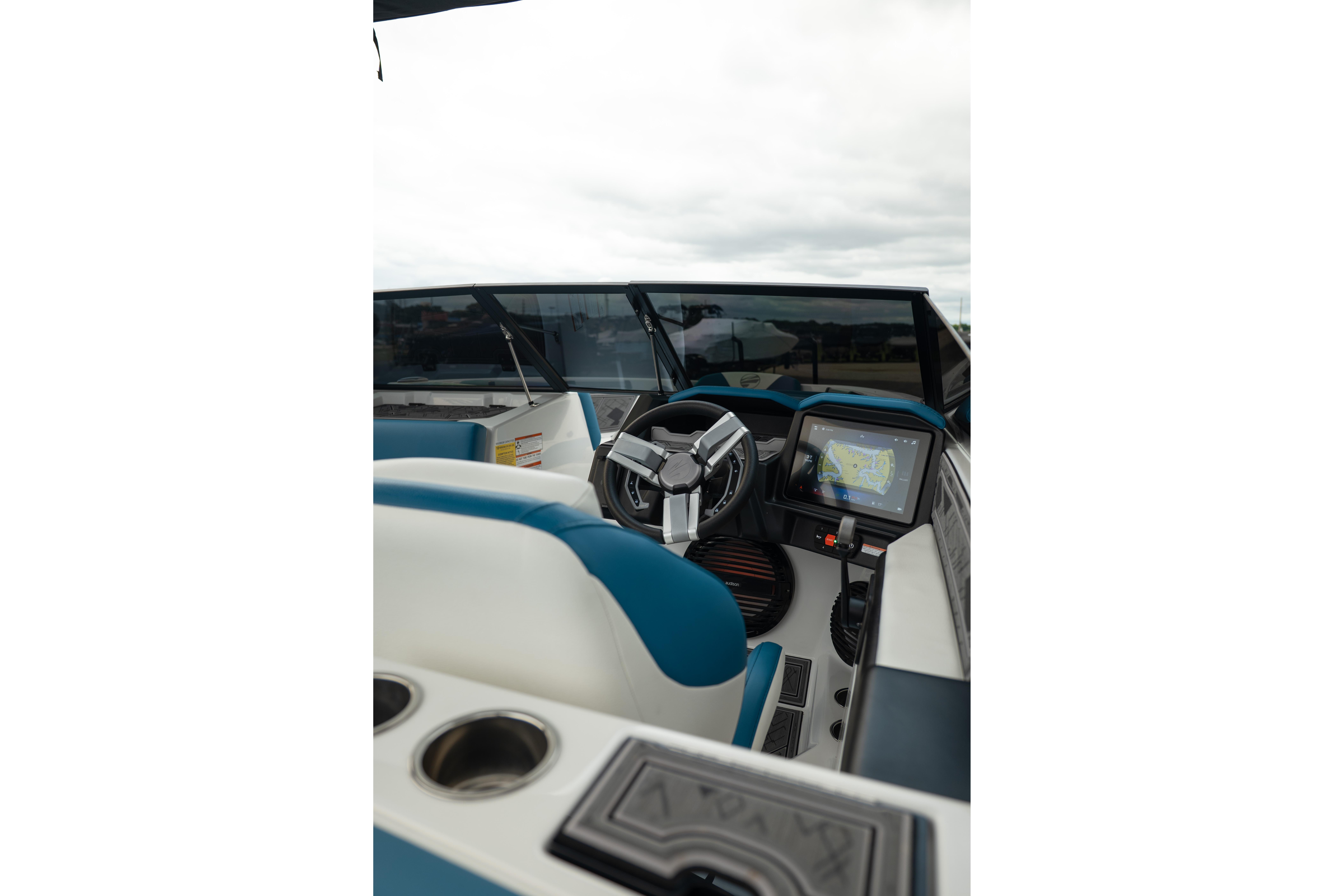 2024 Tigé Z5 boat interior with steering wheel and navigation display.